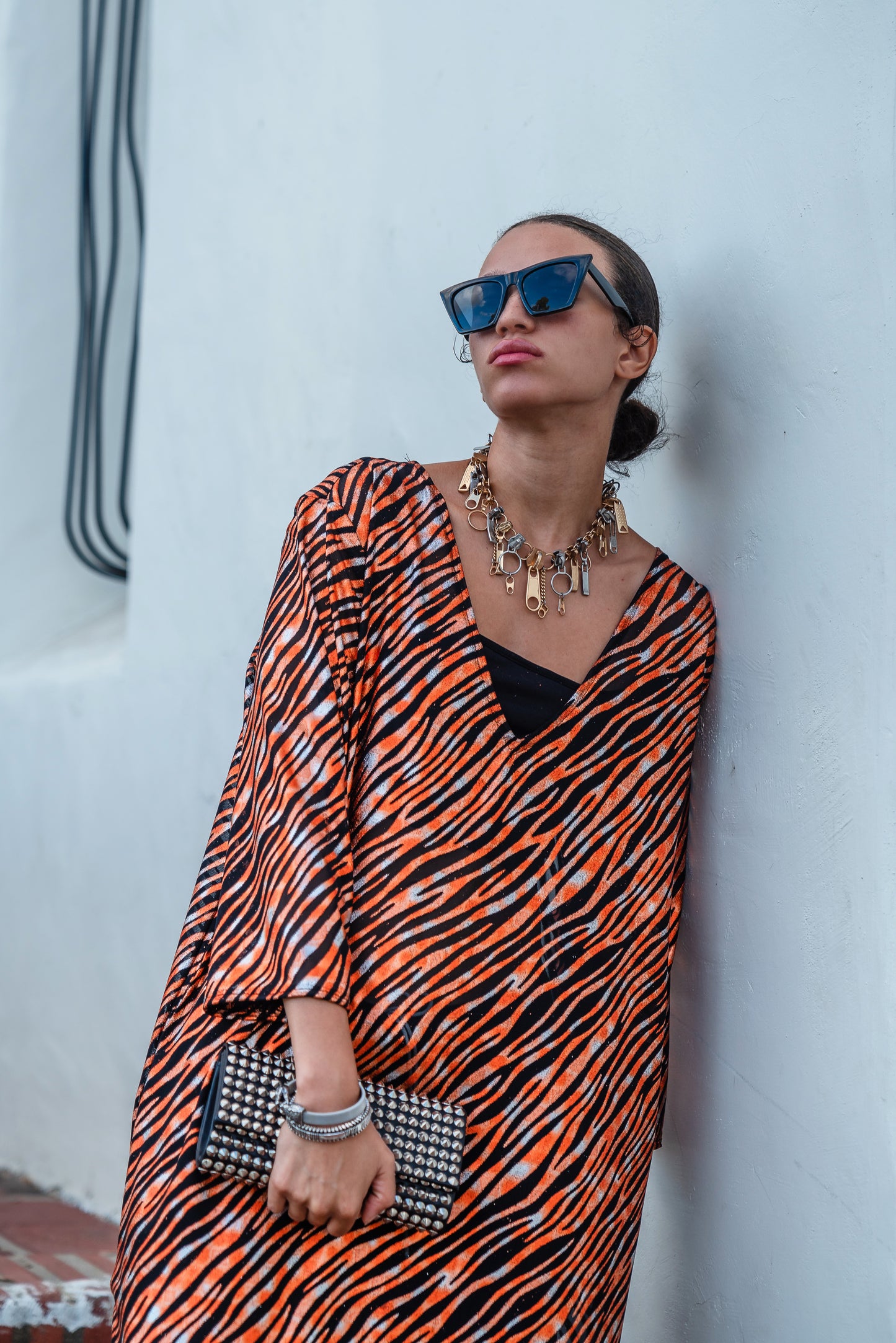 Gold foiled zebra Printed calf length caftan, with sleeves, a v-neck and splits up the side seams to the mid thigh