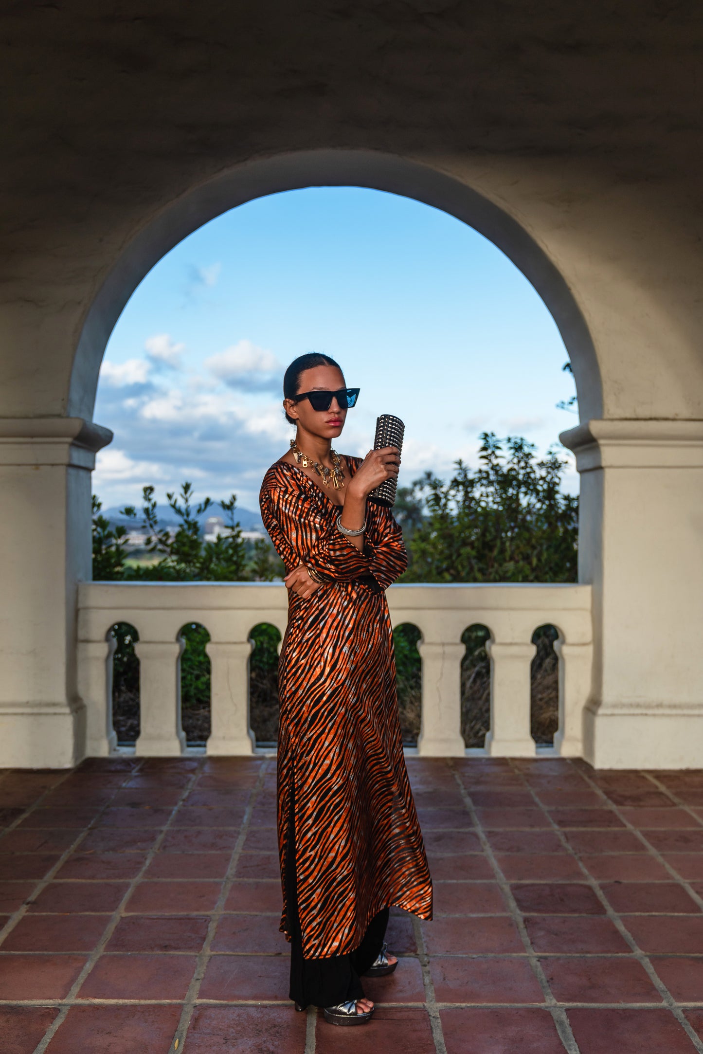Gold foiled zebra Printed calf length caftan, with sleeves, a v-neck and splits up the side seams to the mid thigh
