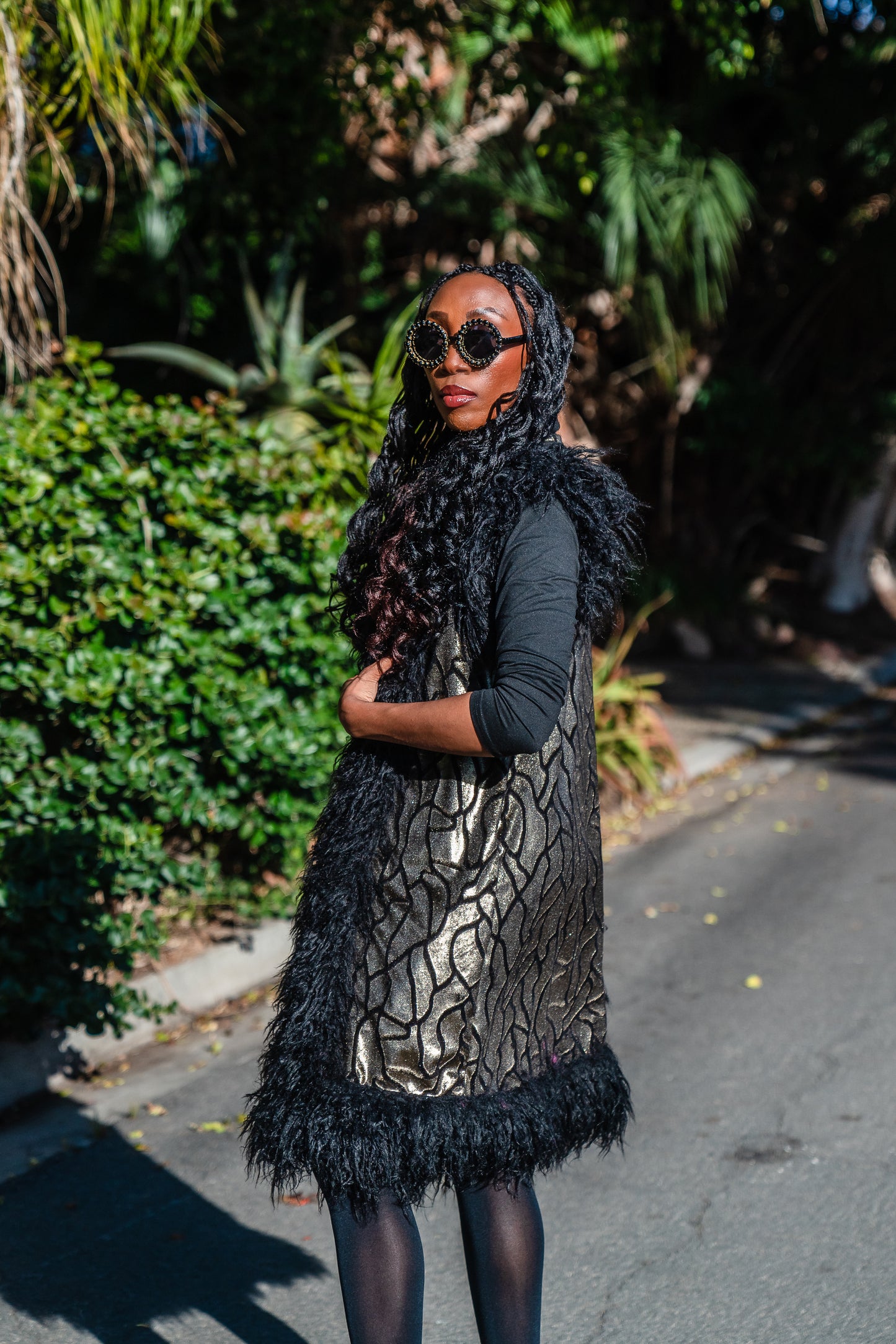 Fur Trim Vest made of shining gold waxed velvet and trimmed with black Mongolian fur. Sleeveless with knee length hem.