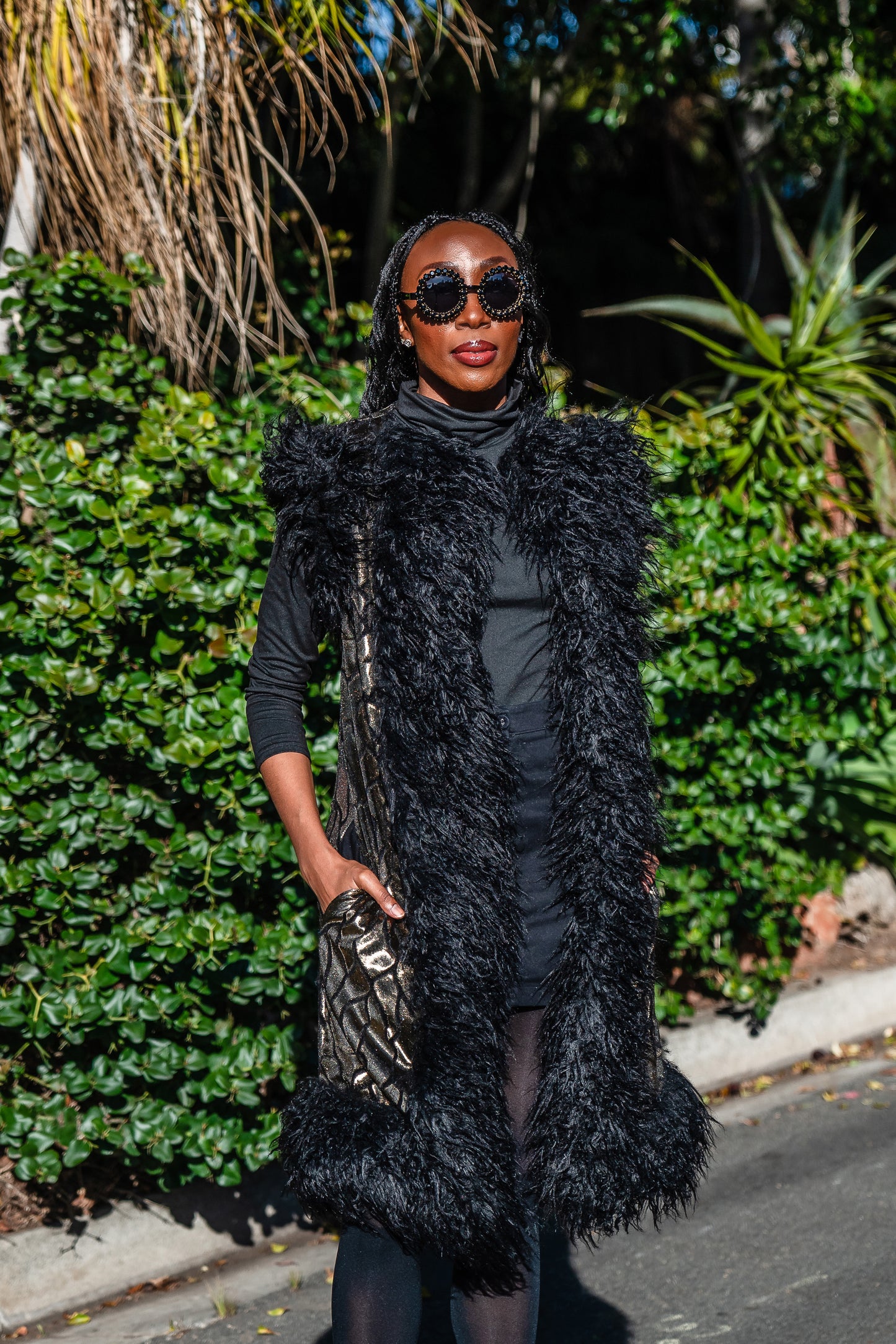 Fur Trim Vest made of shining gold waxed velvet and trimmed with black Mongolian fur. Sleeveless with knee length hem.