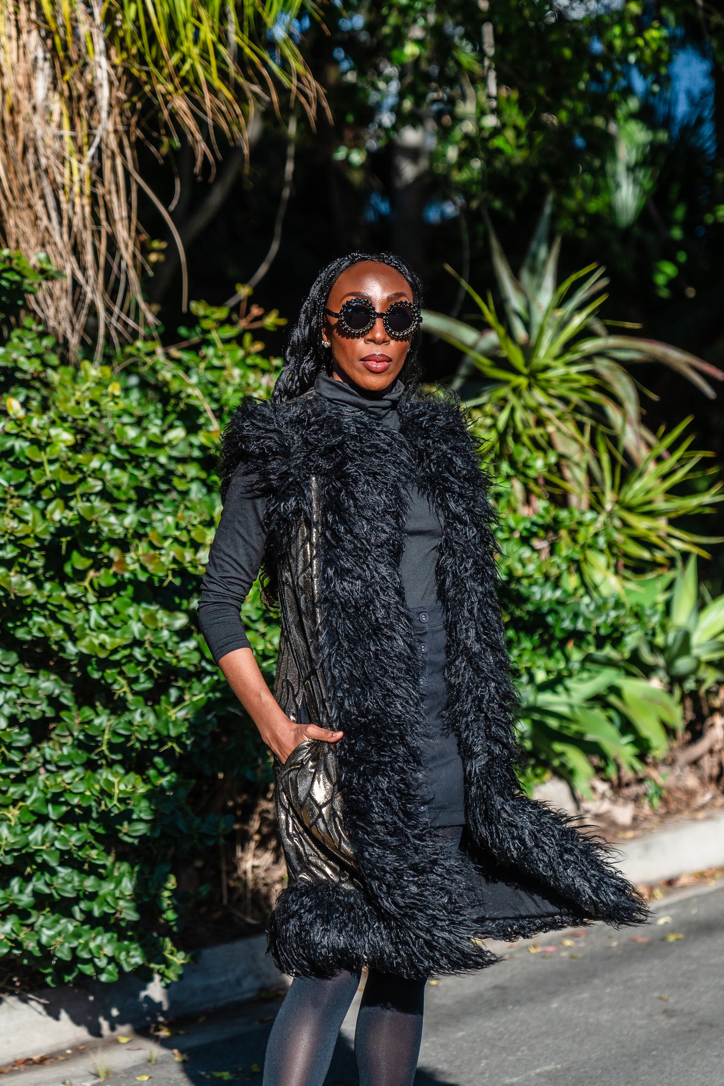 Fur Trim Vest made of shining gold waxed velvet and trimmed with black Mongolian fur. Sleeveless with knee length hem.