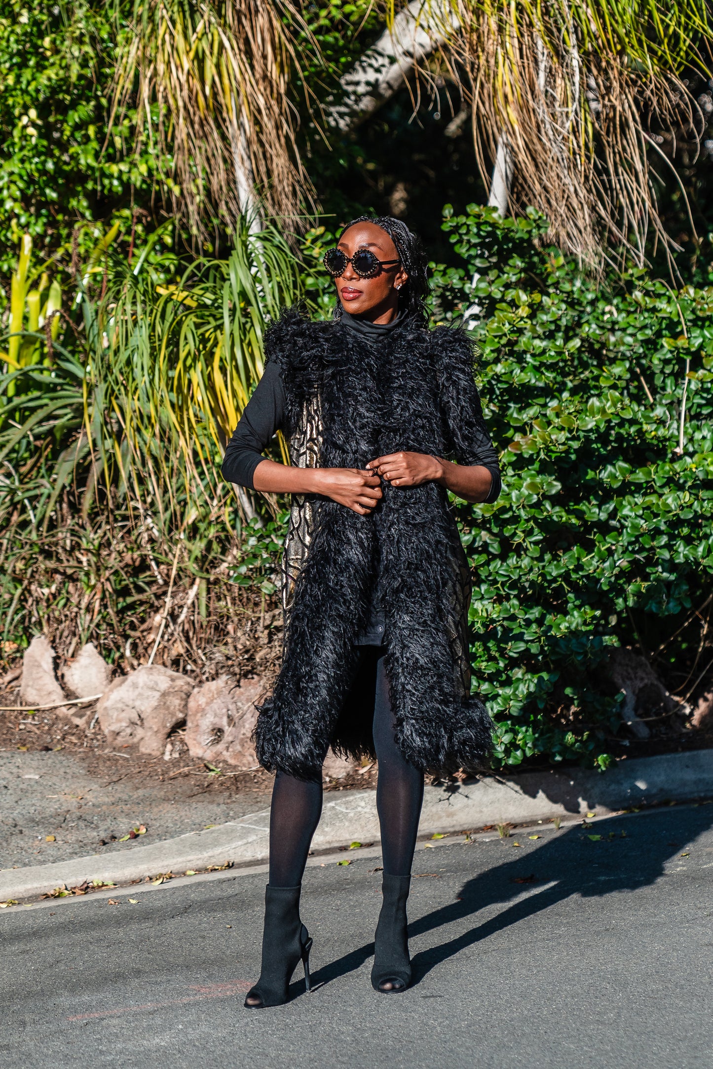 Fur Trim Vest made of shining gold waxed velvet and trimmed with black Mongolian fur. Sleeveless with knee length hem.