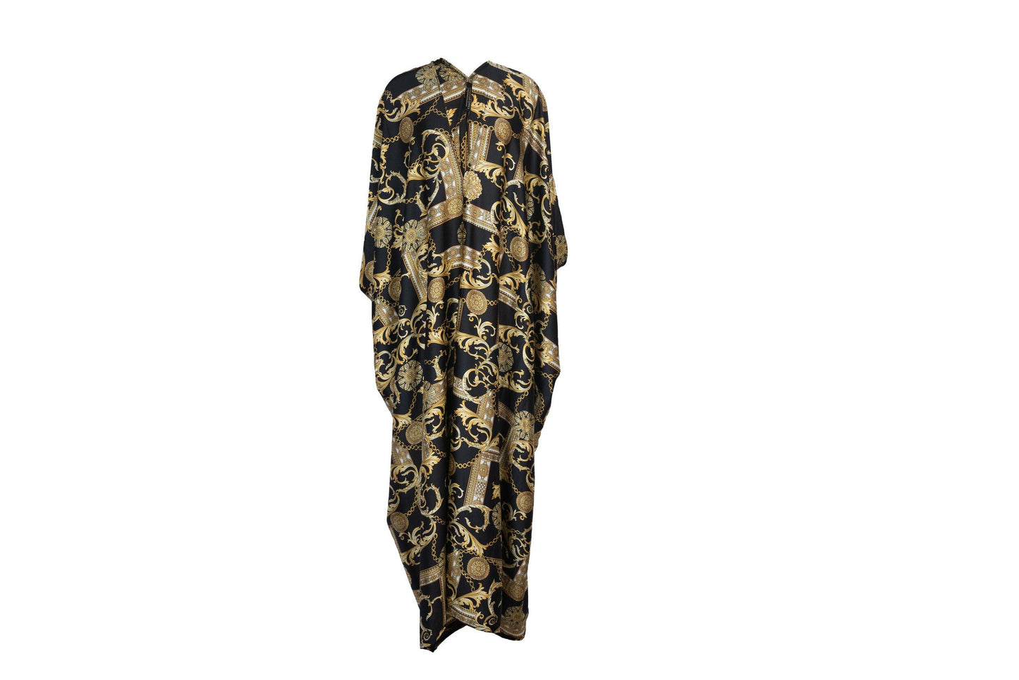 Opaque black caftan dress featuring yellow gold ornamental filigree patterned design. Featuring a deep v-neckline, short batwing sleeves, and an ankle-length hem. This caftan is a voluminous garment that gives a flowy silhouette that drapes beautifully on all shapes.
