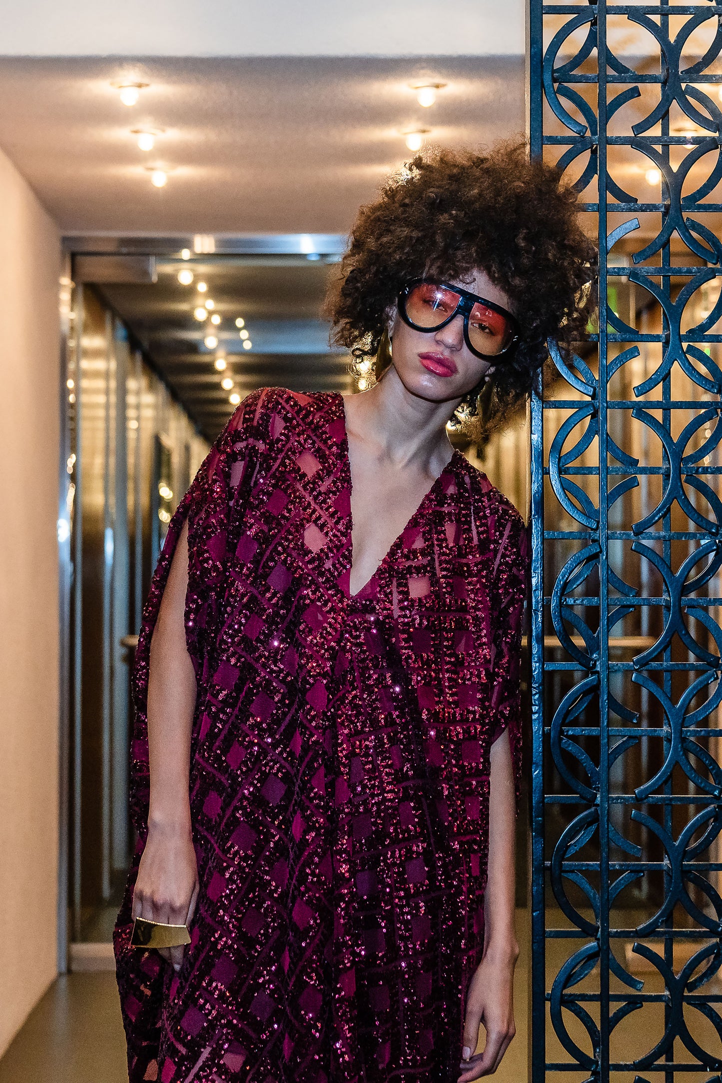 This sparkling red caftan is made from a geometric sequins fabric. Featuring a deep v-neck, batwing sleeves, and ankle length hem. Handmade in Southern California. 