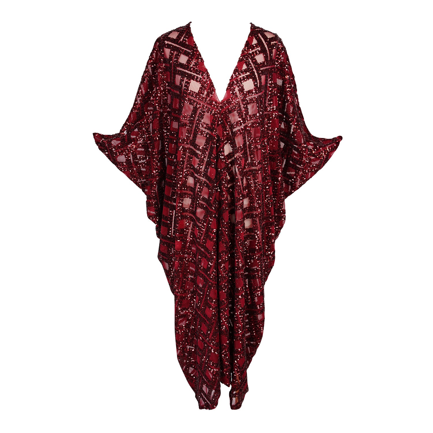 This sparkling red caftan is made from a geometric sequins fabric. Featuring a deep v-neck, batwing sleeves, and ankle length hem. Handmade in Southern California.