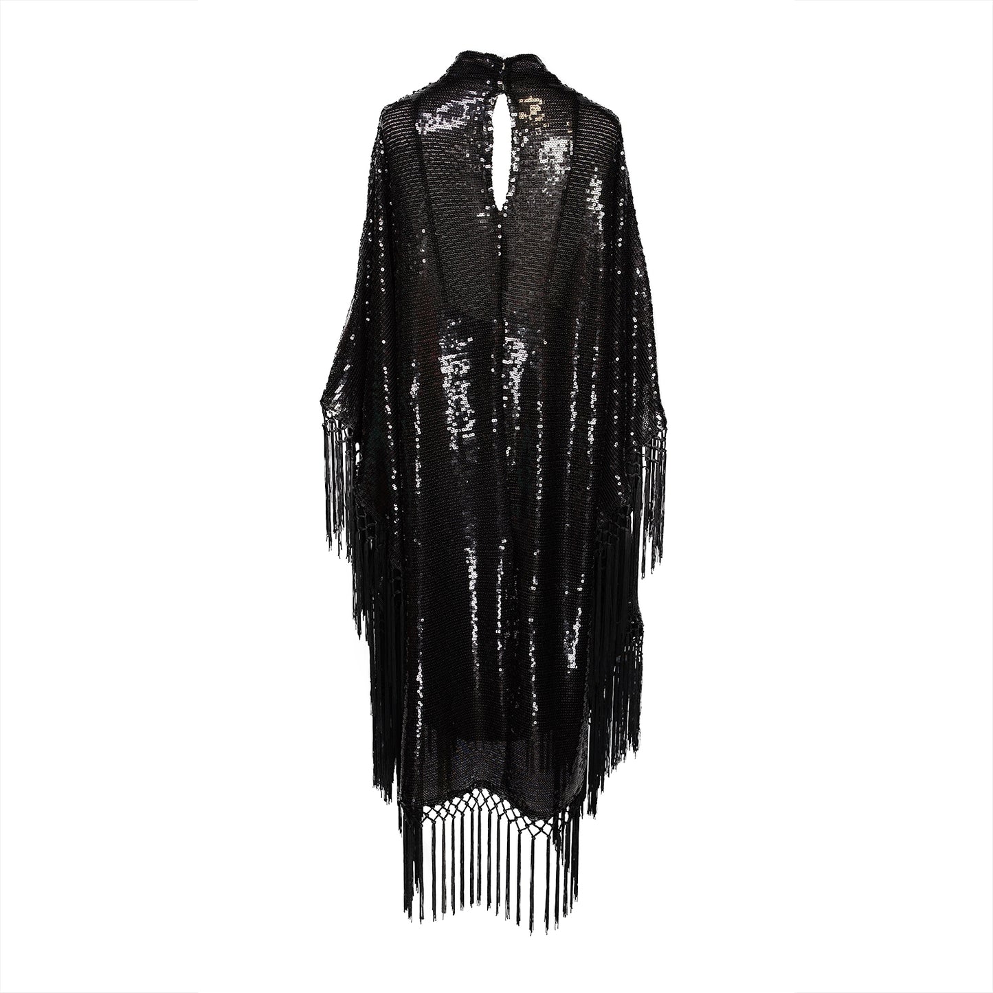 This caftan is a dazzling, full-length garment featuring a shimmering inky black sequin overlay on a mesh fabric. The sequins catch the light, creating a sparkling effect throughout. It has a mock neck collar with a straight, loose fit that drapes elegantly over the body. The edges of the caftan, including the hem and the sides, are embellished with long, black silk fringe that add movement and a playful flair to an elegant and timeless design.