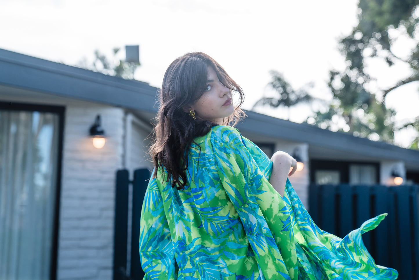 The Biscayne Kimono robe presents a striking combination of pulsating Miami Beach colors: vibrant shades of acid green, turquoise, and aqua. Featuring traditional square sleeves, matching waist tie, deep side pockets, and an ankle length hem.