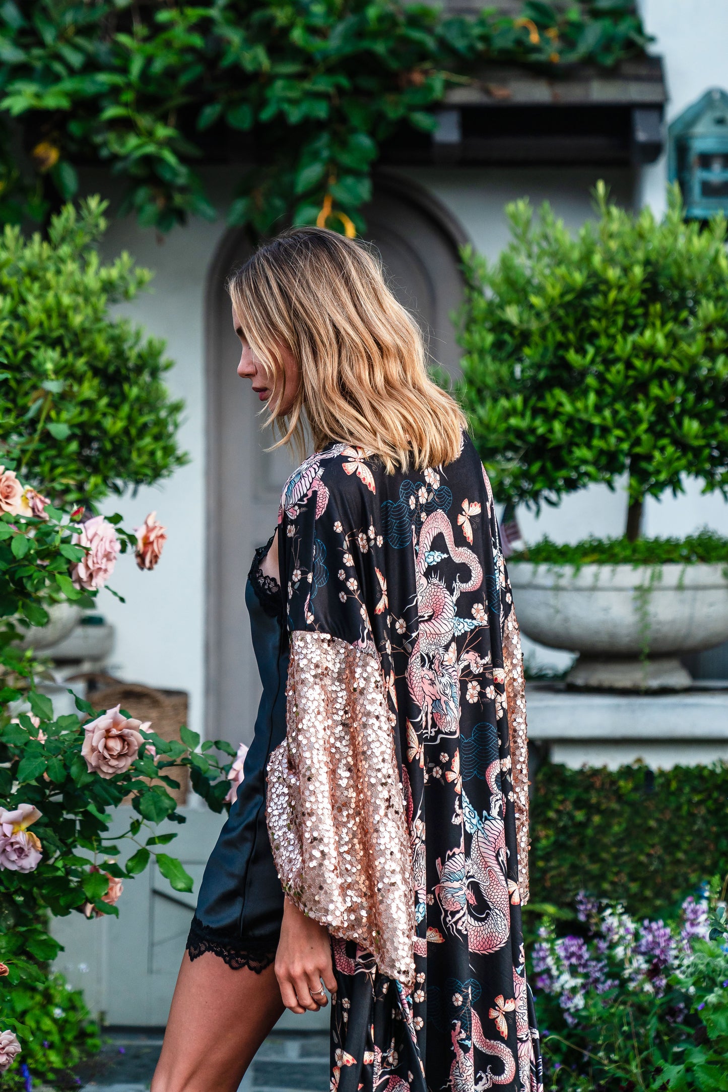 This Kimono is crafted from soft jersey, it features striking dragon print and sequin kimono sleeves.