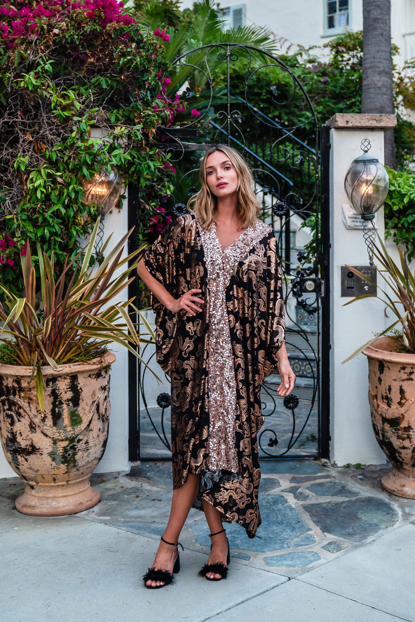 Our lustrous dragon foiled mesh caftan with sequin details is perfect for a summer night out, or as a layering piece in cooler seasons