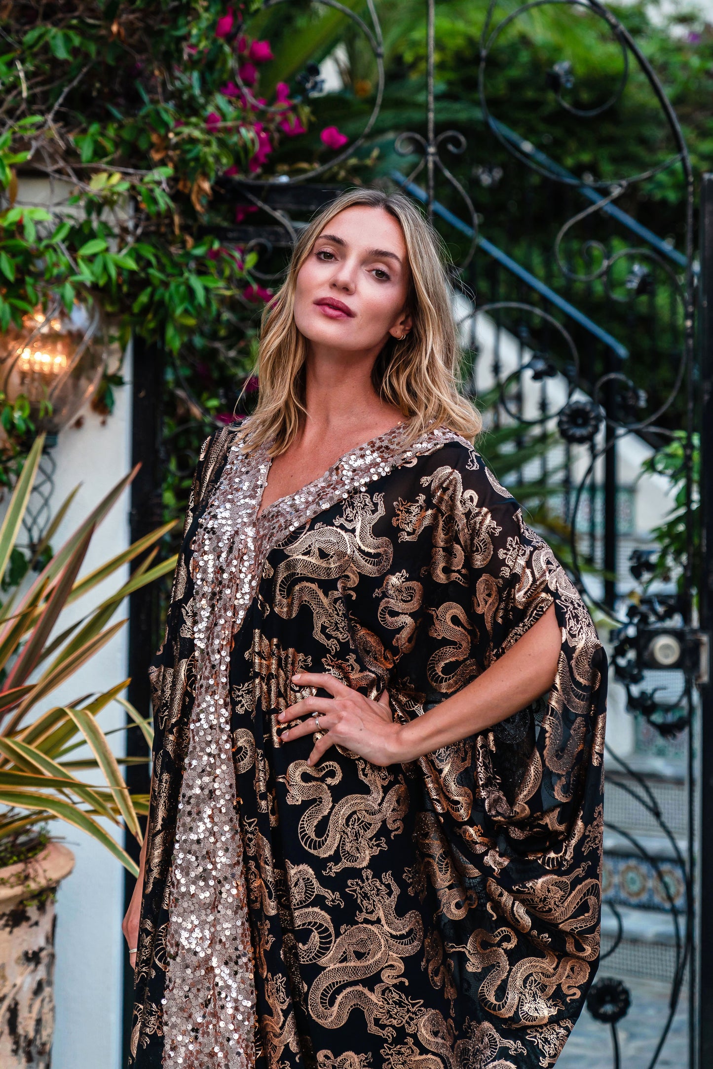 Our lustrous dragon foiled mesh caftan with sequin details is perfect for a summer night out, or as a layering piece in cooler seasons