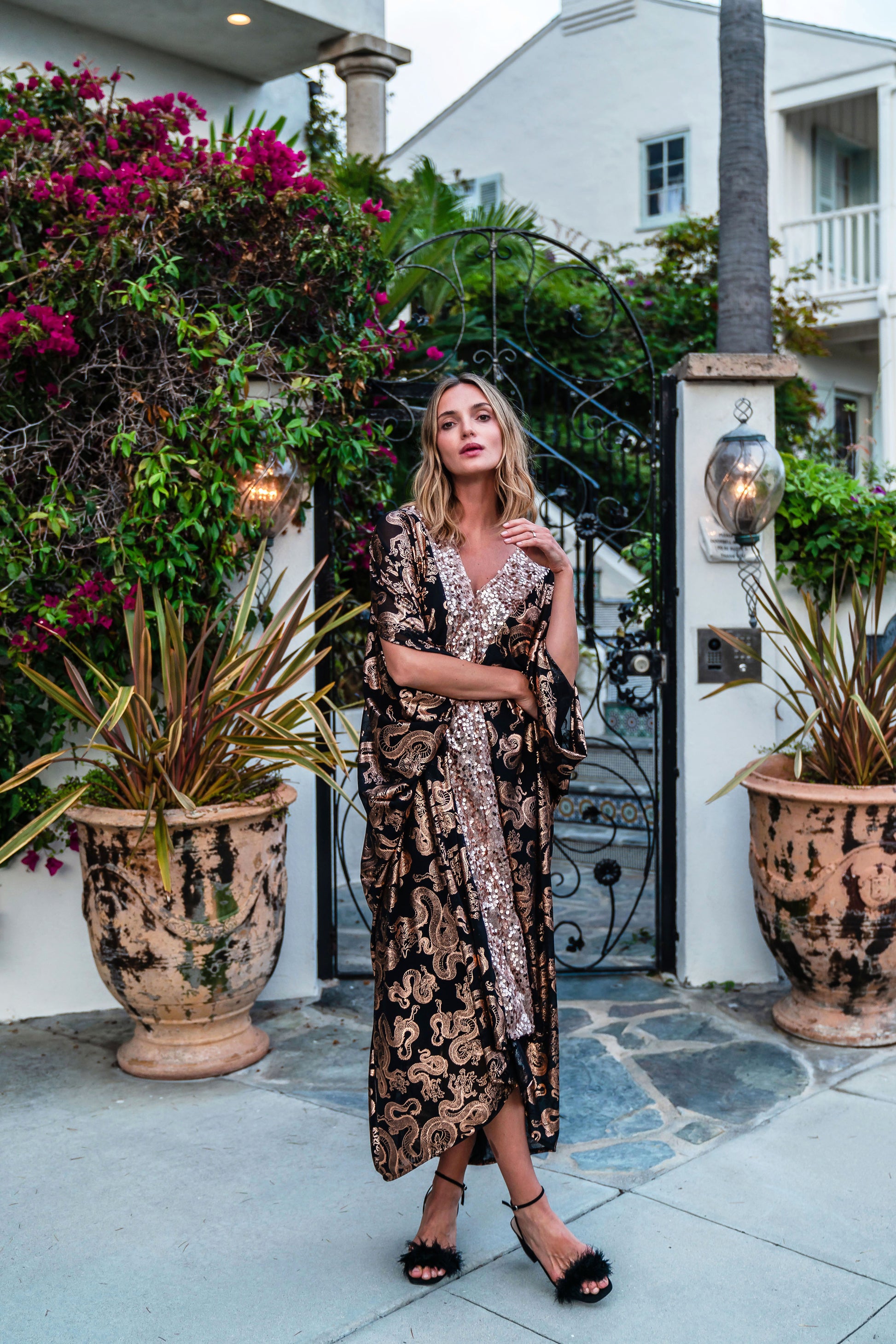 Our lustrous dragon foiled mesh caftan with sequin details is perfect for a summer night out, or as a layering piece in cooler seasons