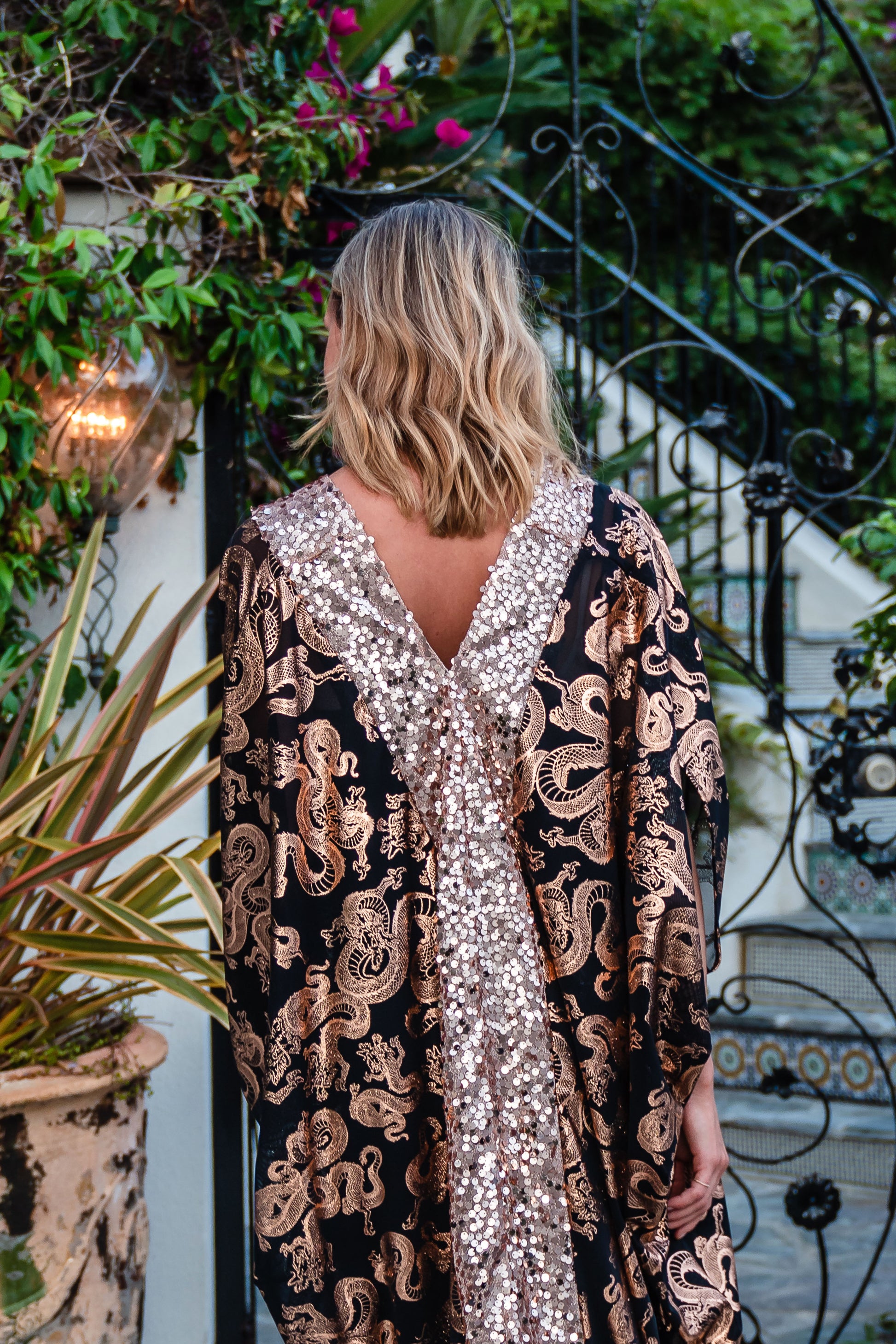 Our lustrous dragon foiled mesh caftan with sequin details is perfect for a summer night out, or as a layering piece in cooler seasons