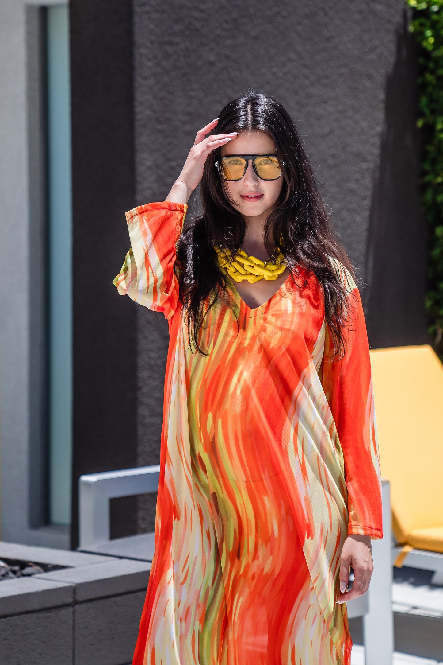 Our Citron Split Hem Caftan With Sleeves! With has vibrant citron orange, bright lime, and vivid yellow colors. This long tunic with high side slits can be a beach cover up