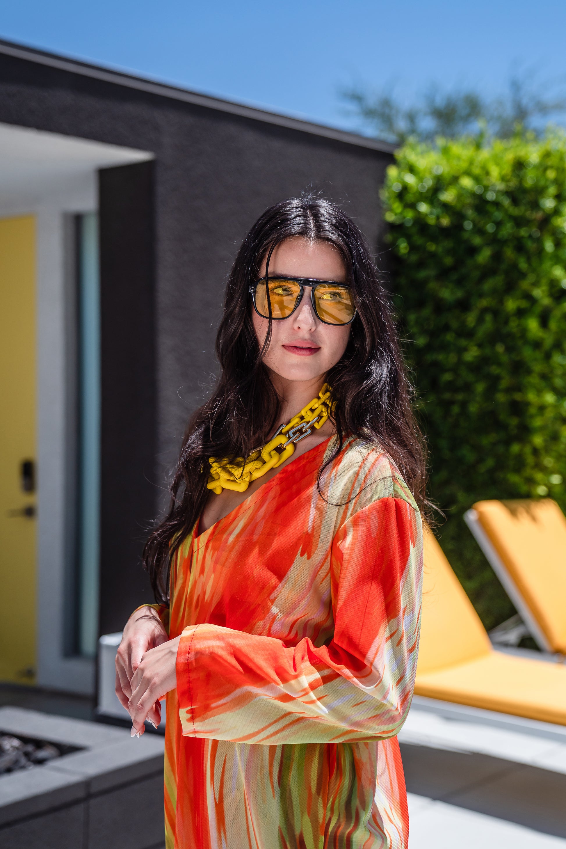 Our Citron Split Hem Caftan With Sleeves! With has vibrant citron orange, bright lime, and vivid yellow colors. This long tunic with high side slits can be a beach cover up