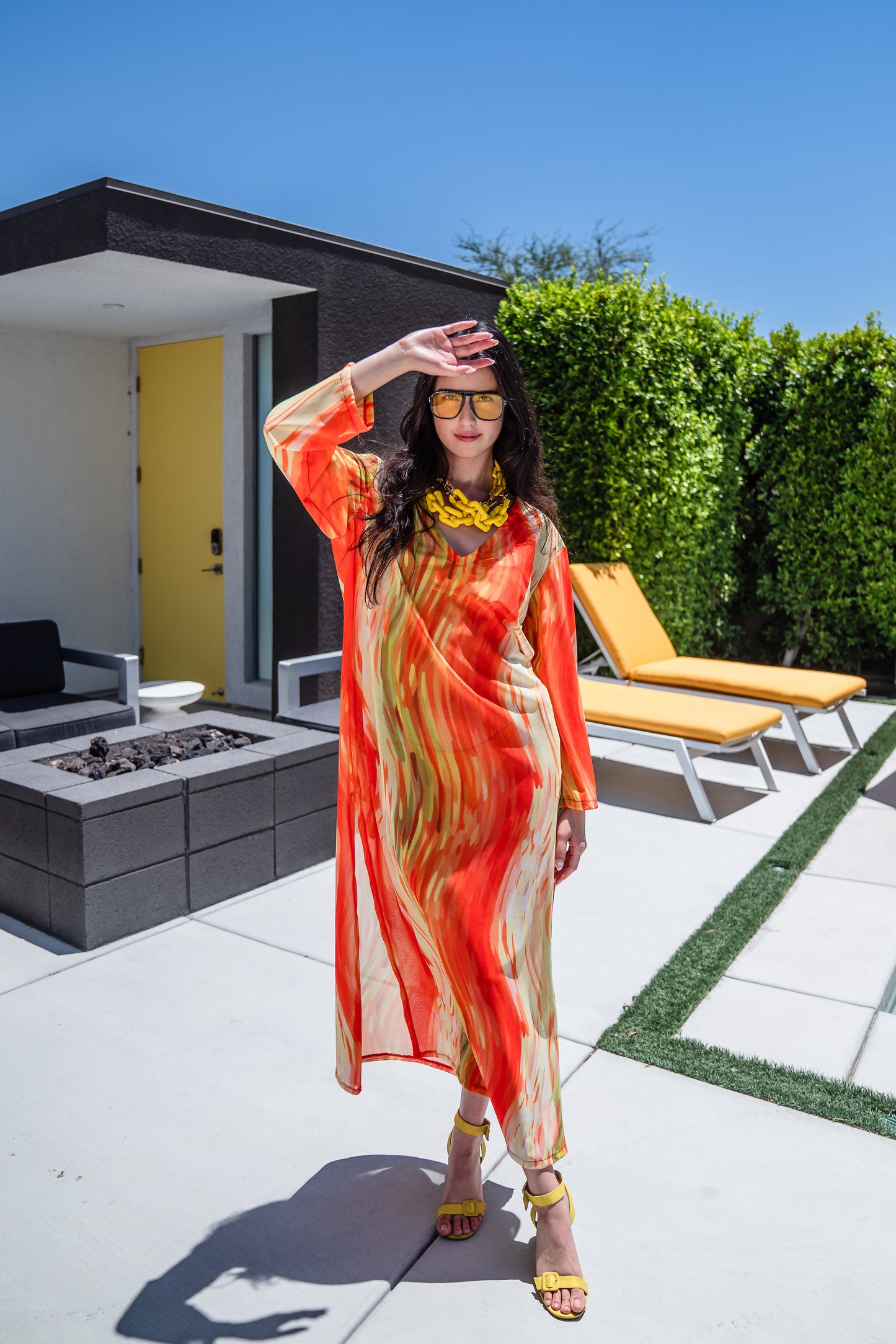 Our Citron Split Hem Caftan With Sleeves! With has vibrant citron orange, bright lime, and vivid yellow colors. This long tunic with high side slits can be a beach cover up