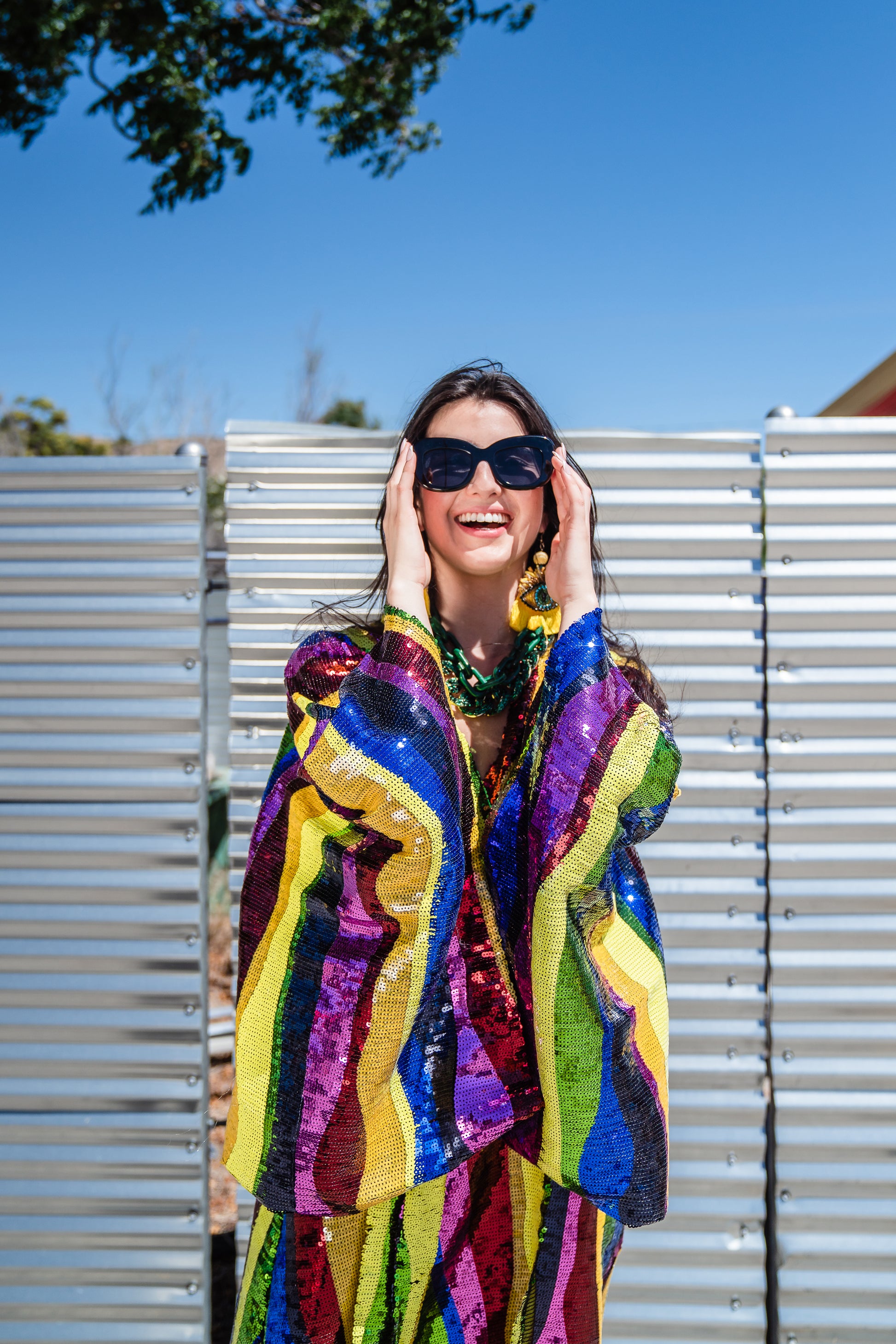 Introducing the Rainbow Road Kimono. This elegant piece boasts an iridescent sequin in a wavy vertical line design with art nouveau inspiration. Featuring an ankle length hem, and drapy rectangular sleeves of a traditional kimono design, and long removeable belt, this kimono can be worn as a stunning dress or layered over your favorite outfits.
