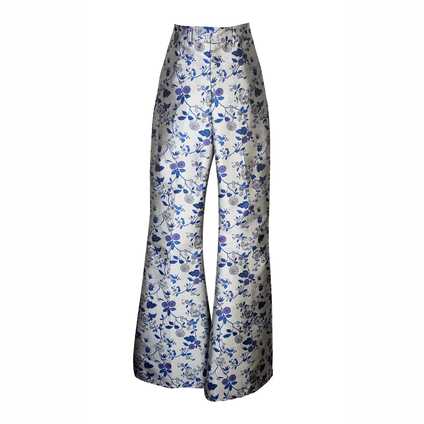 Cool-toned bellbottom pants with a silver and blue floral print. Retro 70's inspired cut with high waist and ankle length hem.