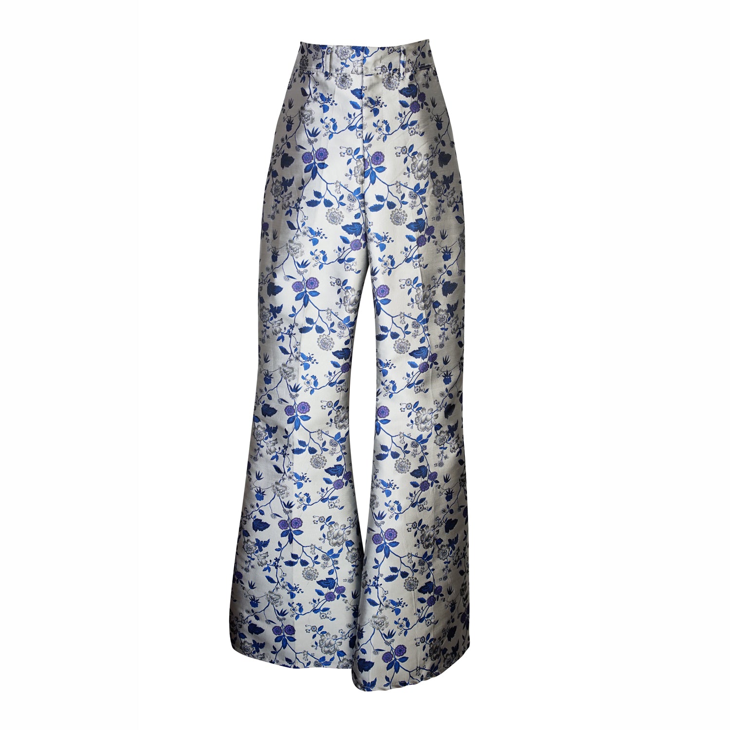 Cool-toned bellbottom pants with a silver and blue floral print. Retro 70's inspired cut with high waist and ankle length hem.