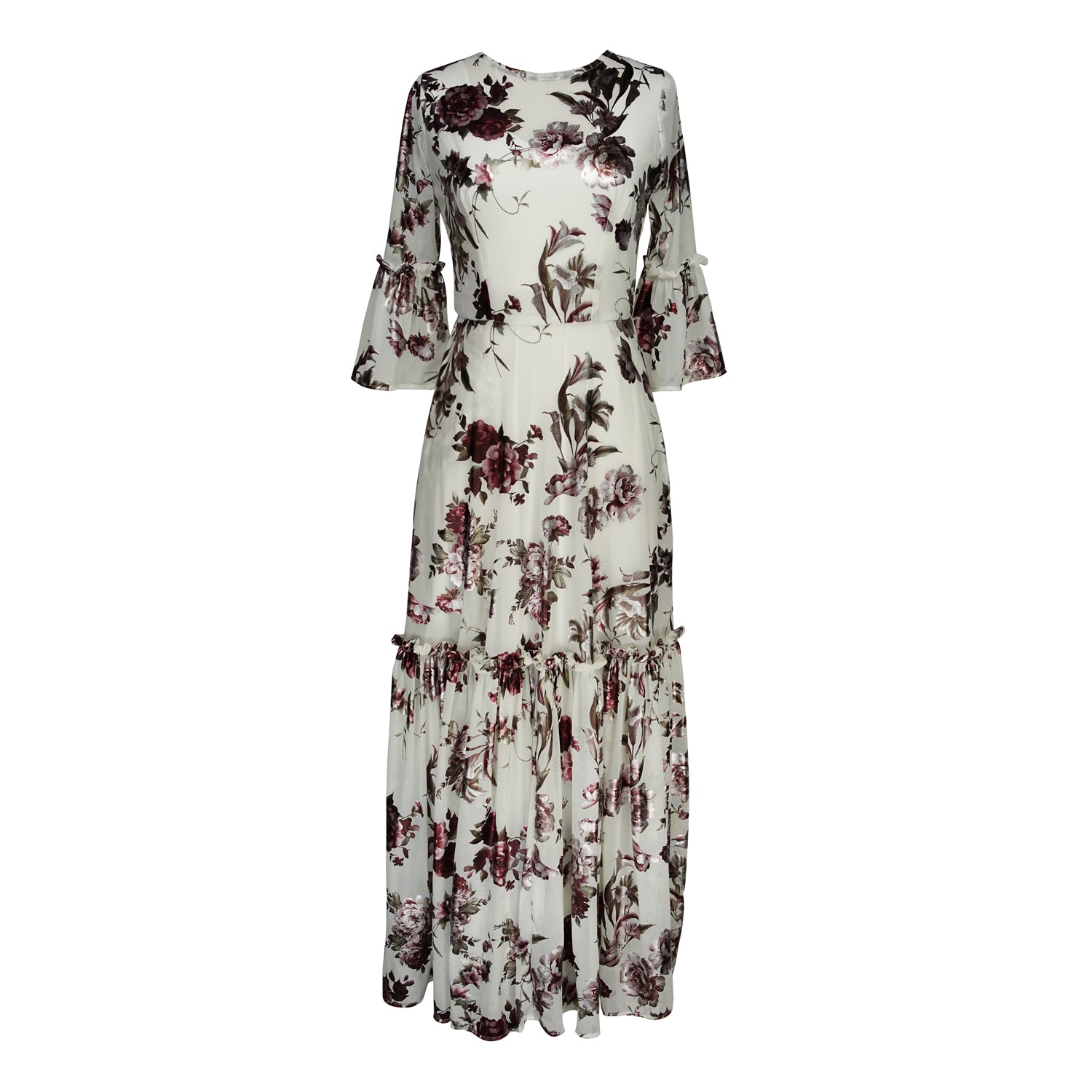 An airy ruffled maxi dress. Made with an airy and metallic detail floral mesh fabric featuring pockets, mid-length bell sleeves, and a full, single-tiered skirt with ankle hem. Includes a matching slip dress that can be worn on its own.