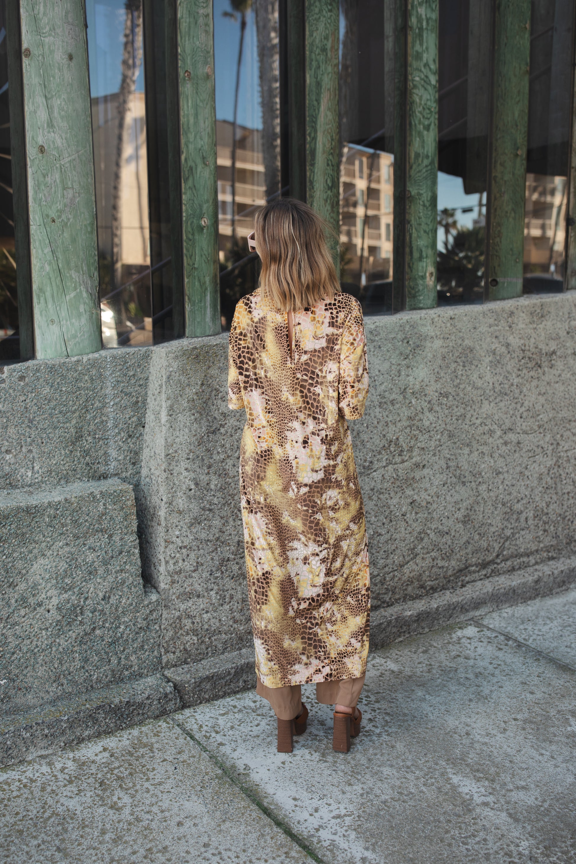 Giraffe velvet side split tunic. This yellow multishade tunic is made from velvet burnout in giraffe pattern. Light, floaty, and slinky it features a back keyhole closure, ankle length hem, mid-length sleeve, and knee length slits on both sides.