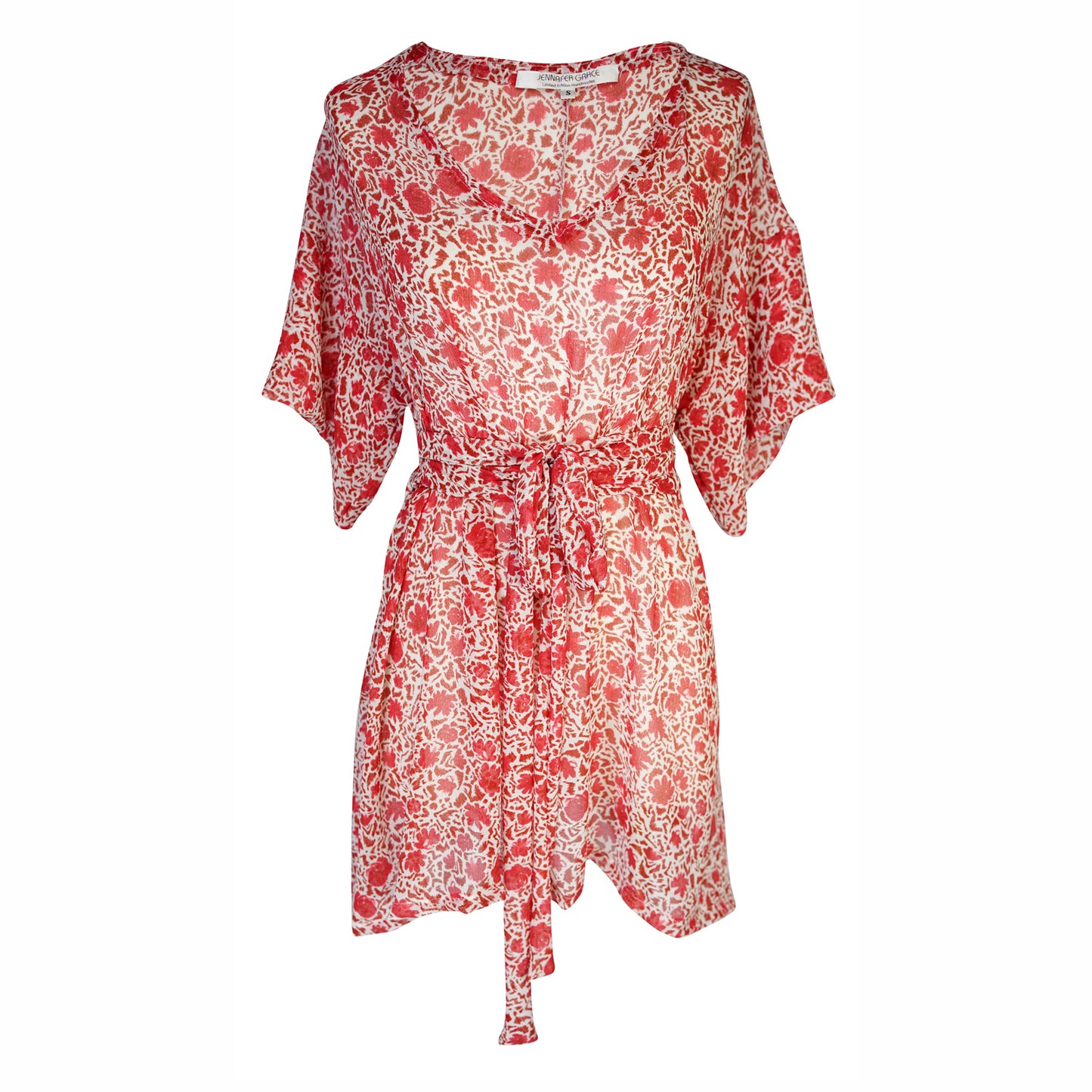 This top is a wrap blouse with a red and ivory floral pattern. It has a v-neckline and short, fluttery sleeves that add a soft, feminine touch. The blouse ties at the waist with a fabric belt, which helps to accentuate the waistline. It is made from a lightweight material that suggests comfort and ease of wear.