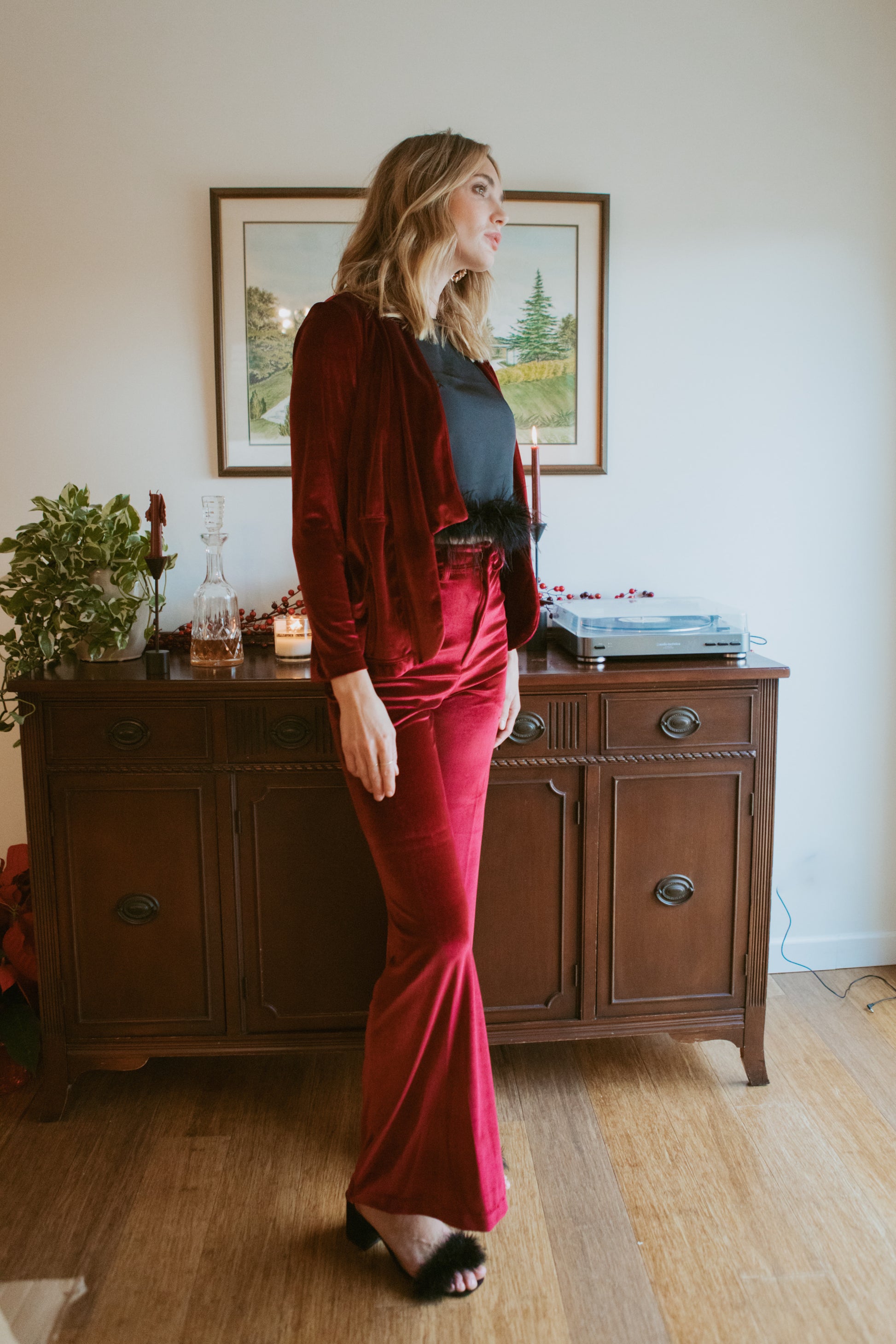 Rich oxblood red velvet bellbottom pants. Featuring a high waist and flared ends in a rich stretch velvet fabric. 