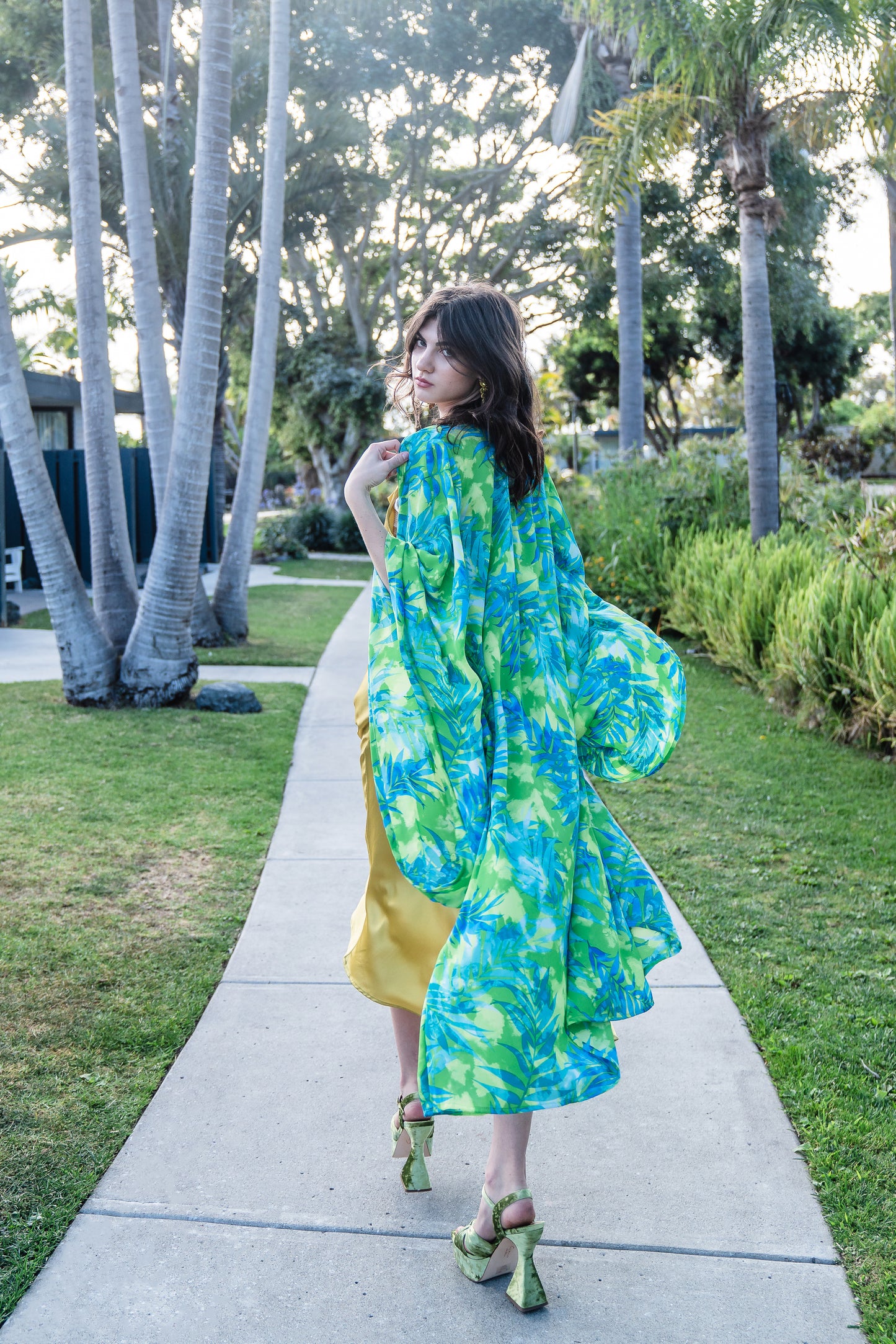 The Biscayne Kimono robe presents a striking combination of pulsating Miami Beach colors: vibrant shades of acid green, turquoise, and aqua. Featuring traditional square sleeves, matching waist tie, deep side pockets, and an ankle length hem.