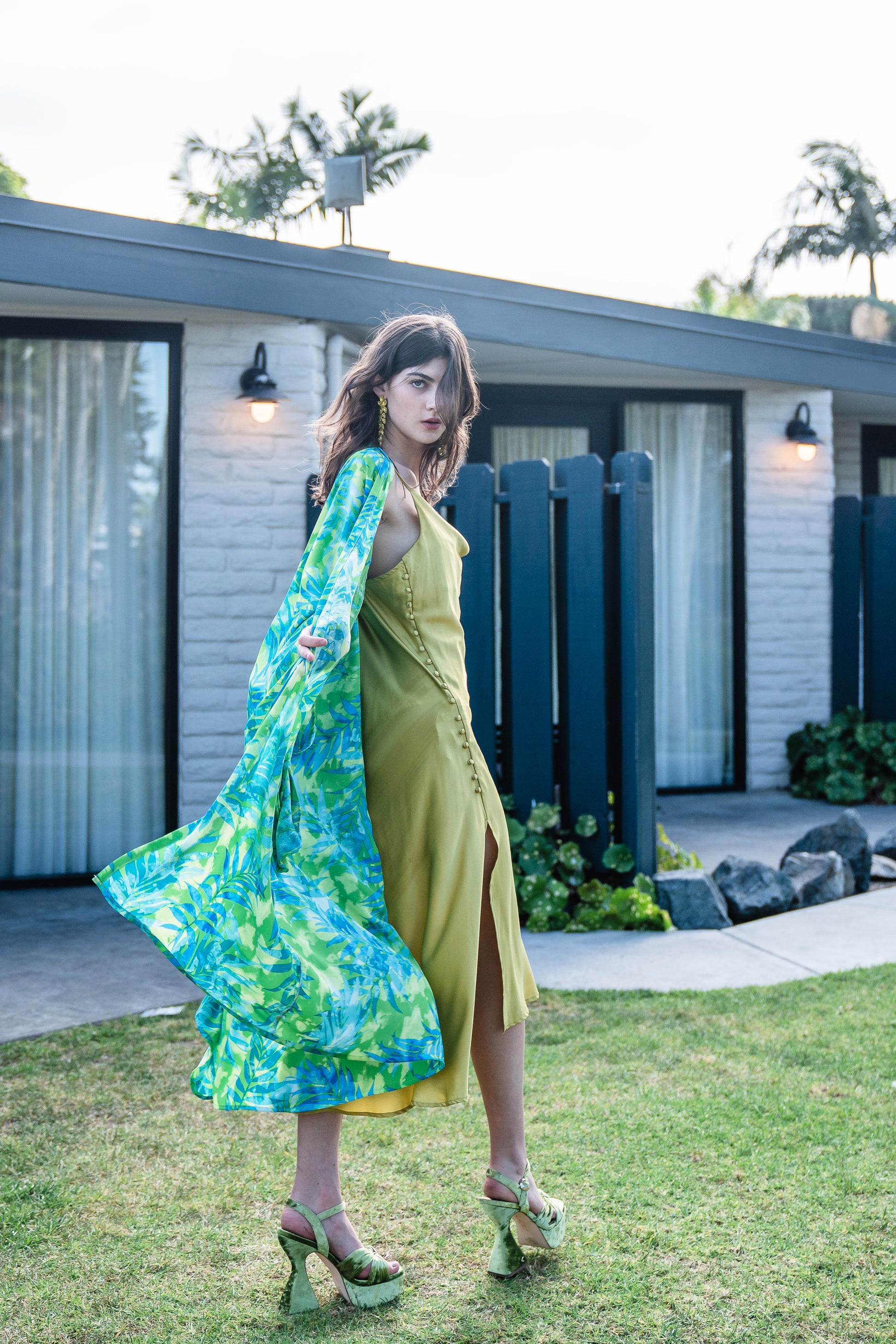 The Biscayne Kimono robe presents a striking combination of pulsating Miami Beach colors: vibrant shades of acid green, turquoise, and aqua. Featuring traditional square sleeves, matching waist tie, deep side pockets, and an ankle length hem.