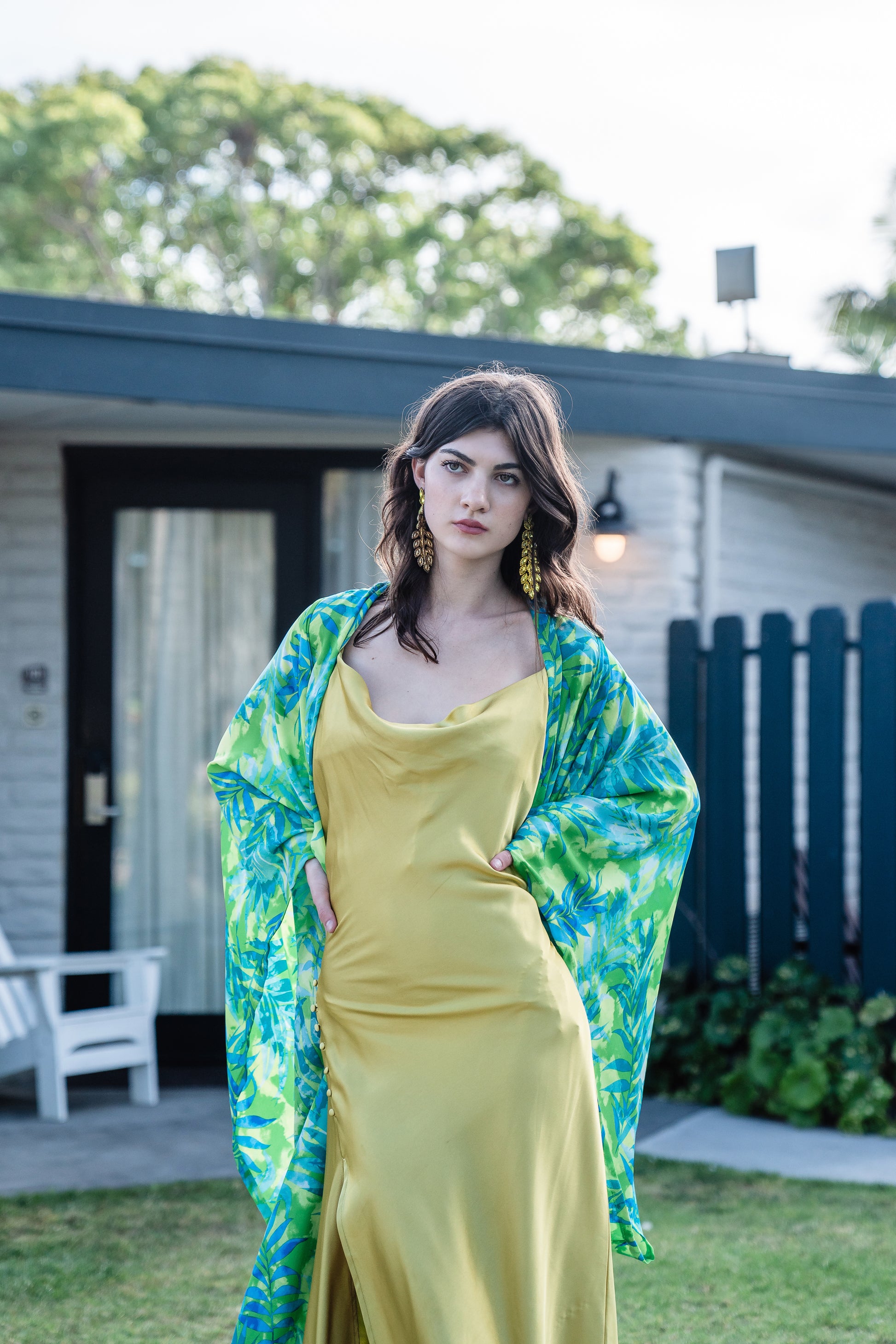 The Biscayne Kimono robe presents a striking combination of pulsating Miami Beach colors: vibrant shades of acid green, turquoise, and aqua. Featuring traditional square sleeves, matching waist tie, deep side pockets, and an ankle length hem.