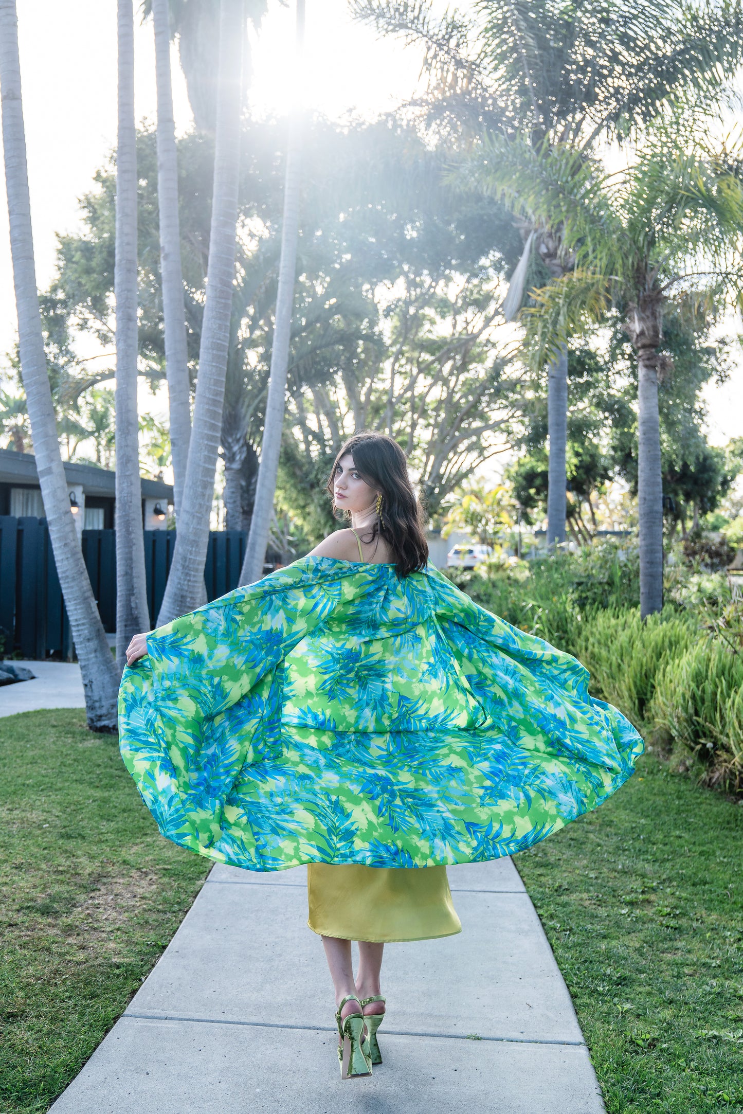 The Biscayne Kimono robe presents a striking combination of pulsating Miami Beach colors: vibrant shades of acid green, turquoise, and aqua. Featuring traditional square sleeves, matching waist tie, deep side pockets, and an ankle length hem.