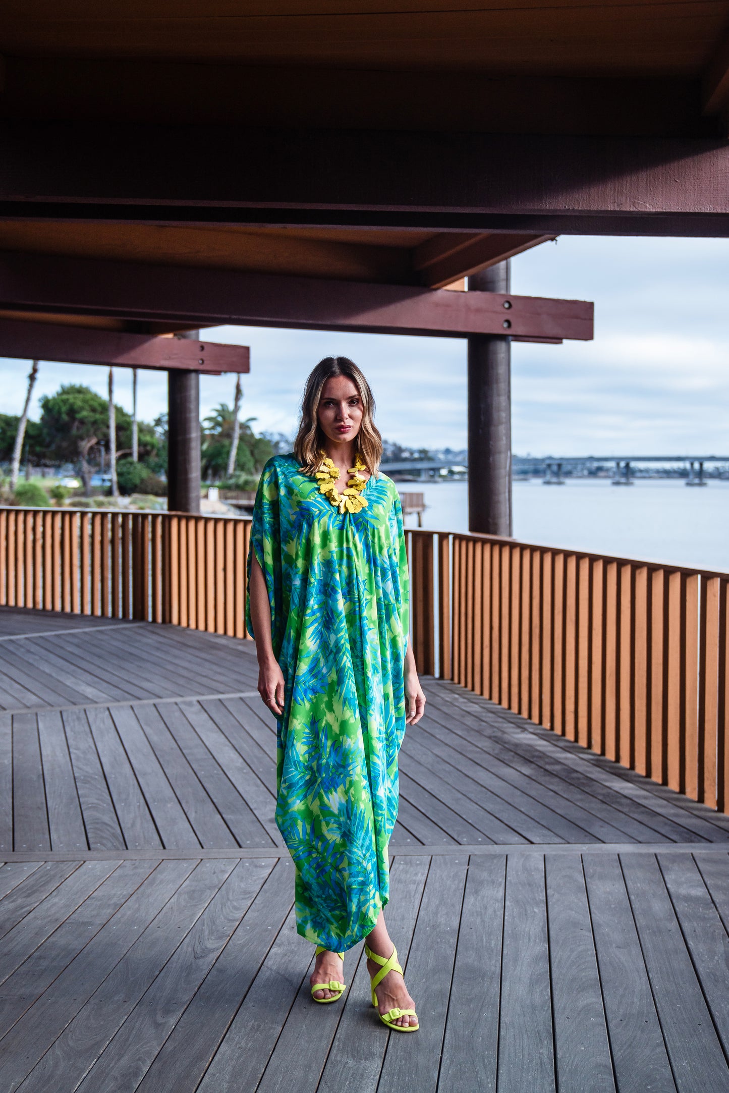 Make a statement with our breezy Biscayne Bay Caftan. Featuring vibrant colors such as fluorescent lime green and electric turquoise