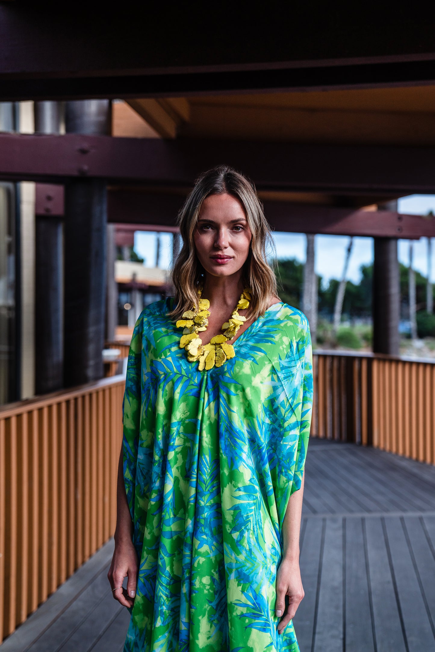 Make a statement with our breezy Biscayne Bay Caftan. Featuring vibrant colors such as fluorescent lime green and electric turquoise