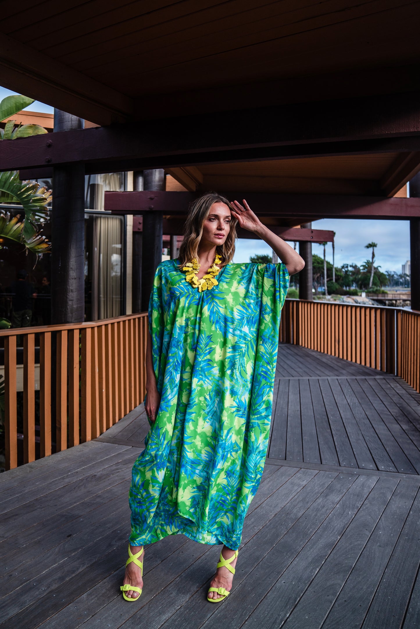 Make a statement with our breezy Biscayne Bay Caftan. Featuring vibrant colors such as fluorescent lime green and electric turquoise