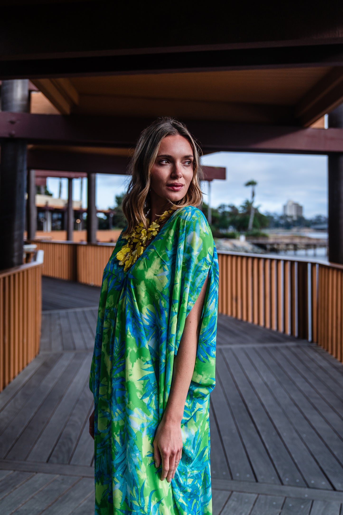 Make a statement with our breezy Biscayne Bay Caftan. Featuring vibrant colors such as fluorescent lime green and electric turquoise