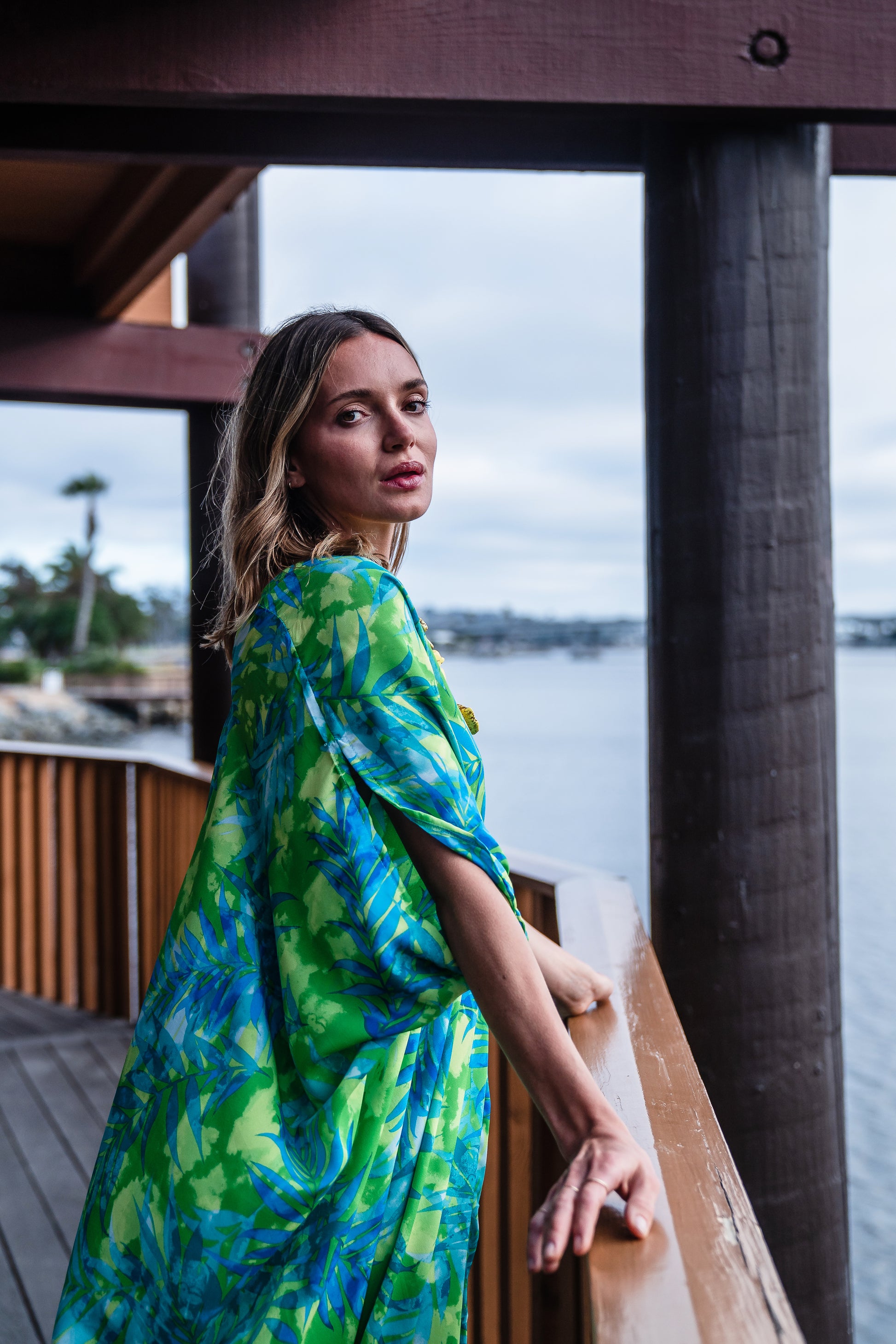 Make a statement with our breezy Biscayne Bay Caftan. Featuring vibrant colors such as fluorescent lime green and electric turquoise
