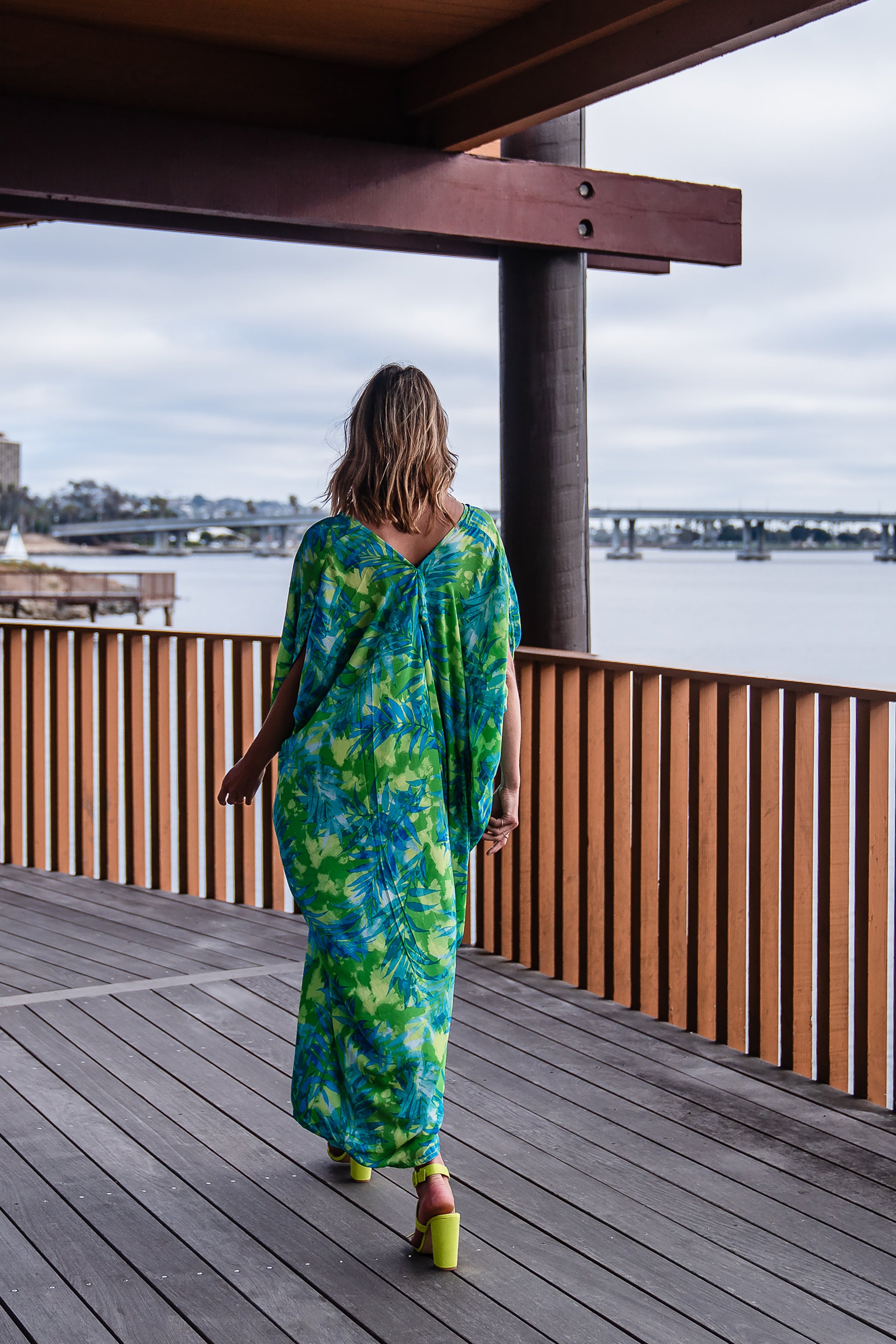 Make a statement with our breezy Biscayne Bay Caftan. Featuring vibrant colors such as fluorescent lime green and electric turquoise