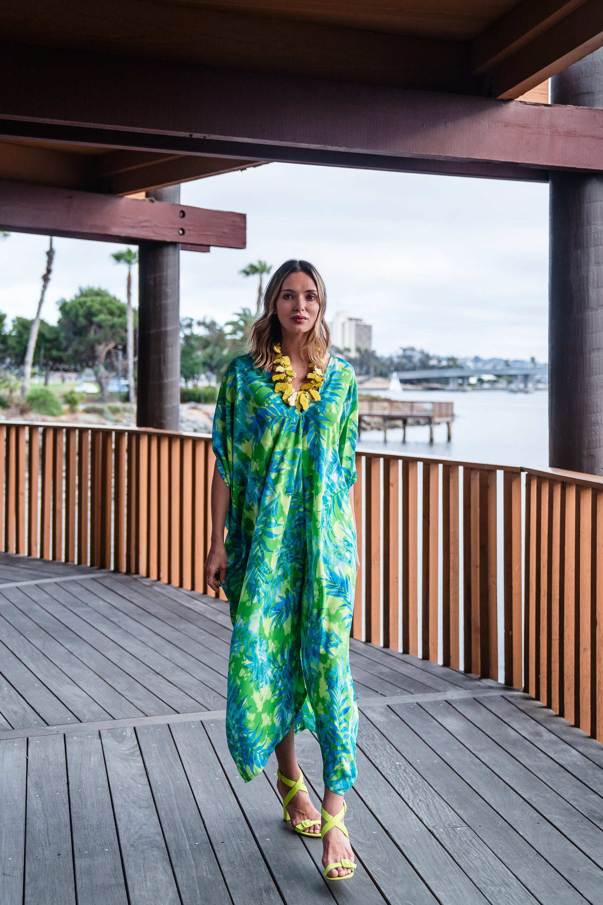 Make a statement with our breezy Biscayne Bay Caftan. Featuring vibrant colors such as fluorescent lime green and electric turquoise