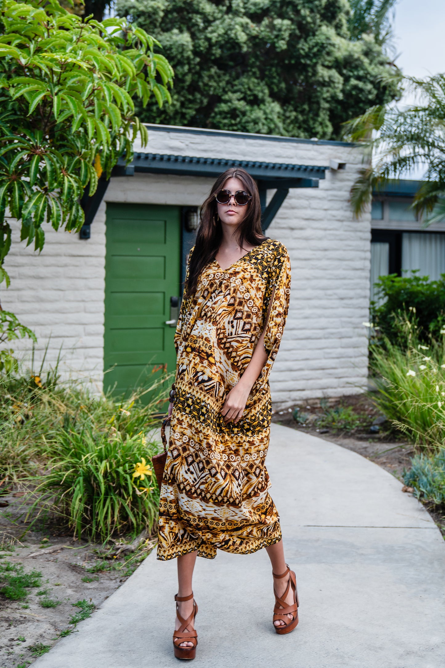 This retro tiki inspired caftan has bold colors and intricate patterns 