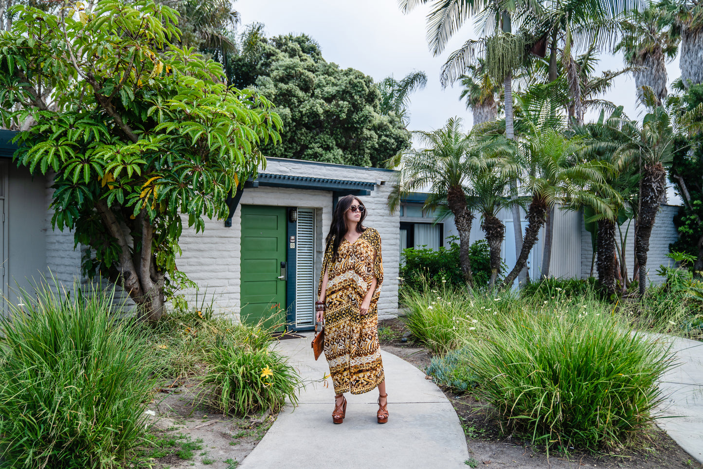 This retro tiki inspired caftan has bold colors and intricate patterns 