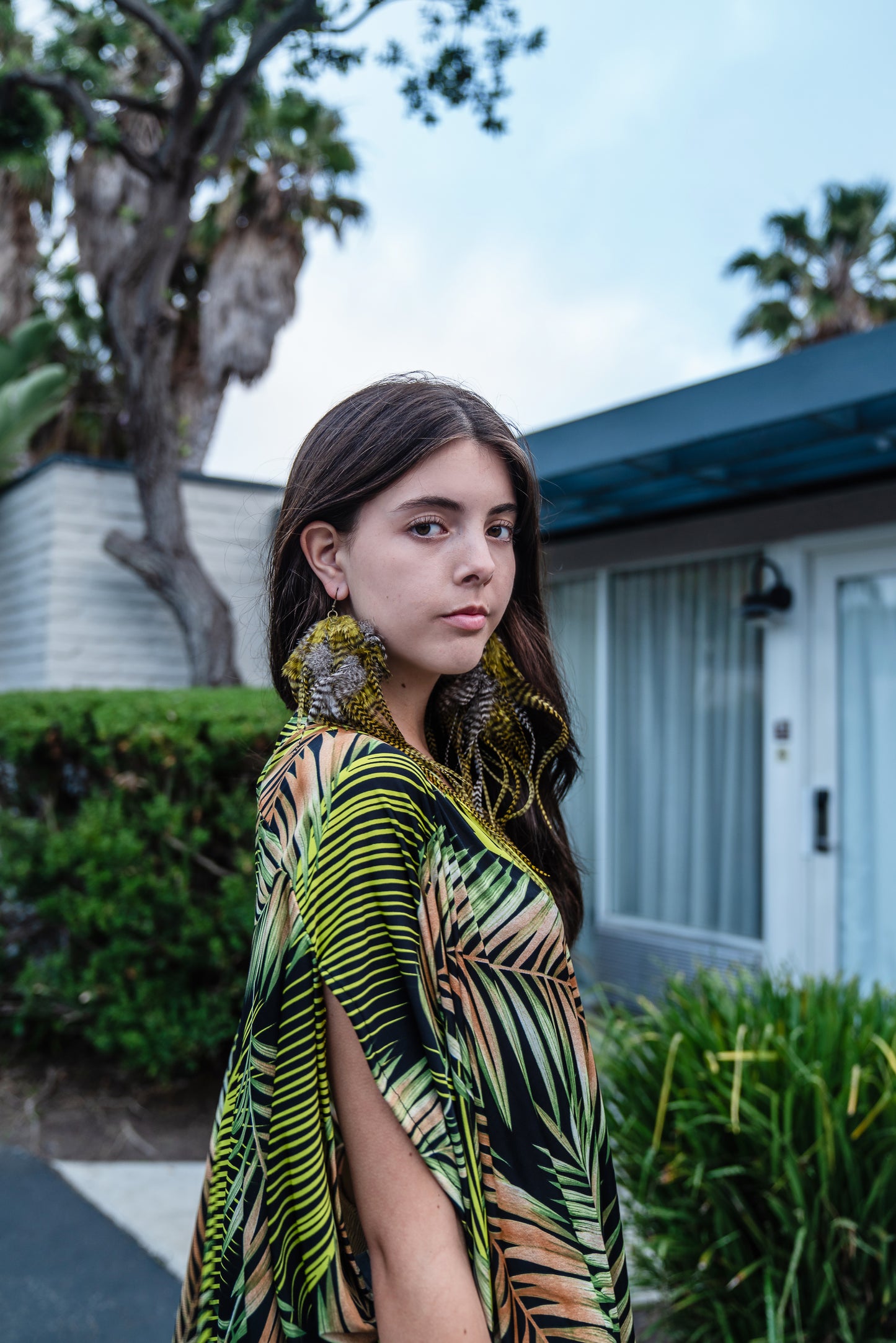 This caftan has an amazing photorealistic palm leaf print on a black background 