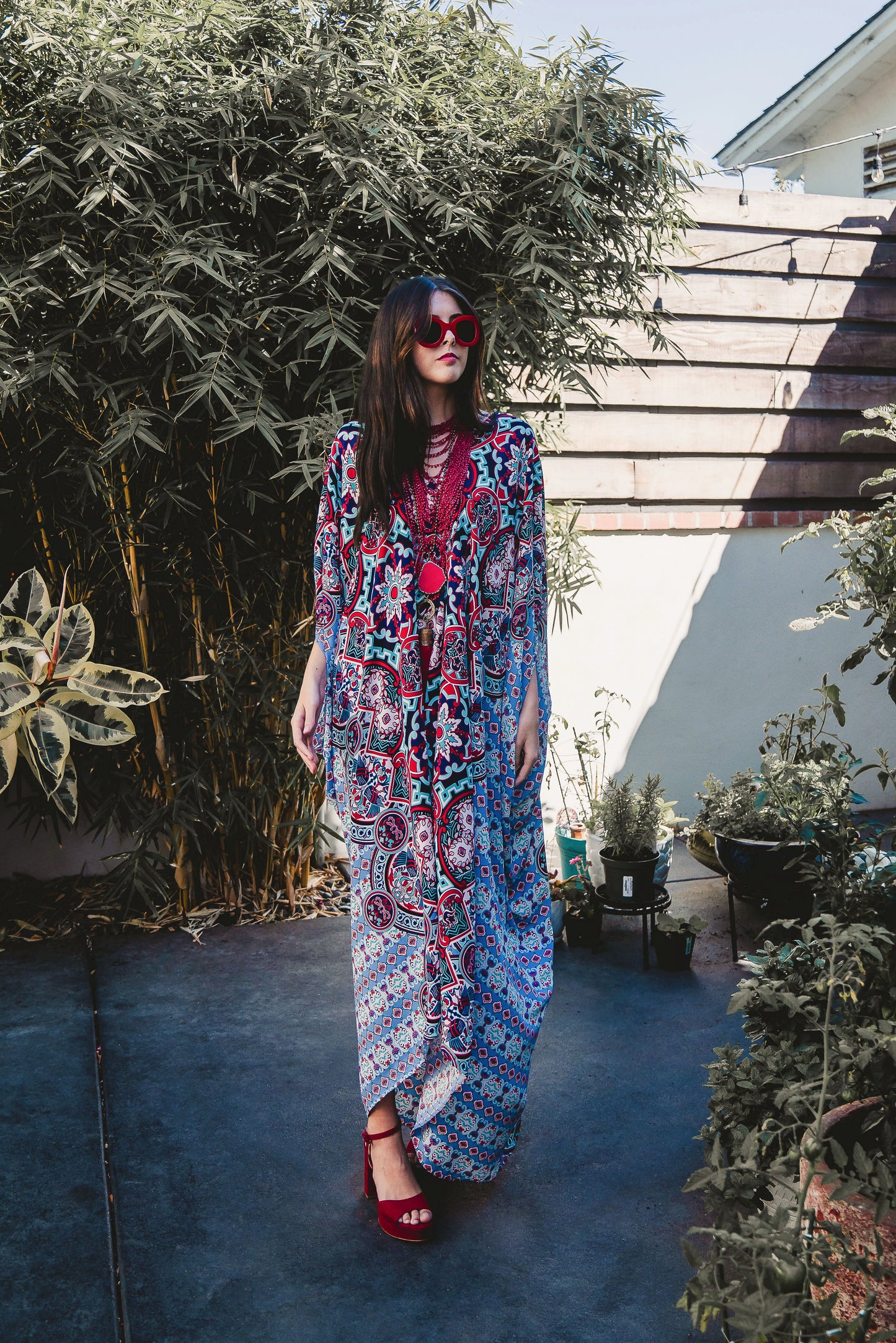 This Persephone Royale Caftan features a beautiful mosaic tile and Greek bird print in royal blue, red, and hints of teal.