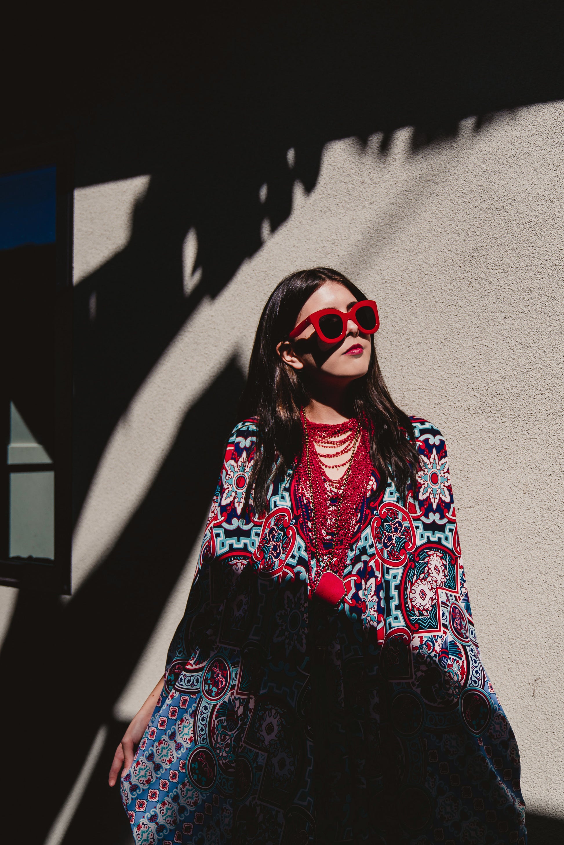 This Persephone Royale Caftan features a beautiful mosaic tile and Greek bird print in royal blue, red, and hints of teal.