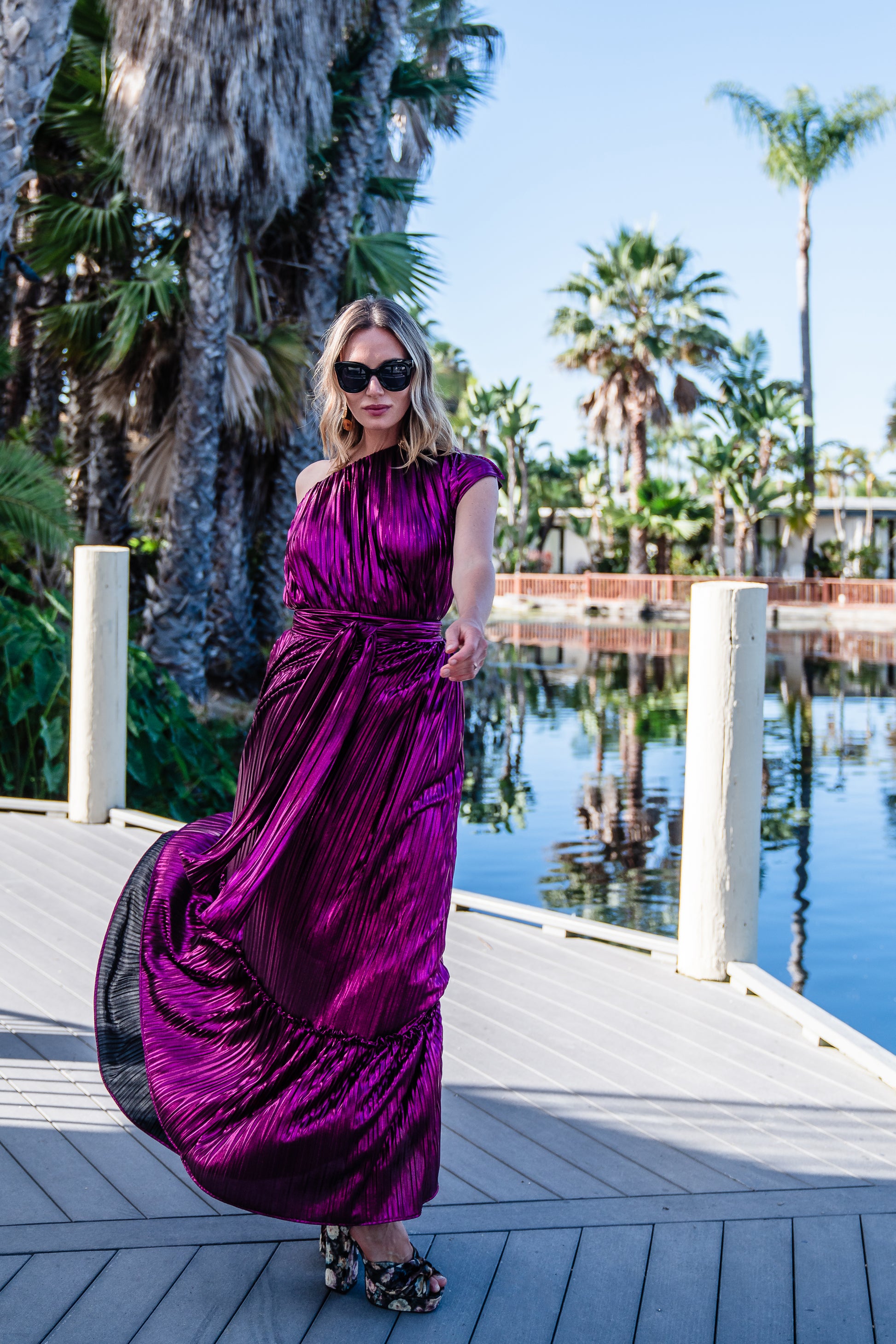 Effortlessly elegant, the Midnight Bubblegum Pleated Maxi Dress features a flattering one shoulder design and an eye-catching ink shimmer pleated fabric.