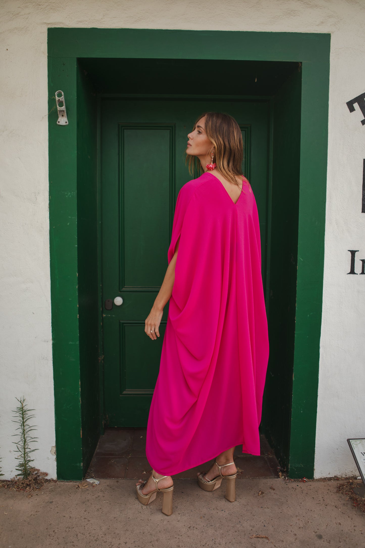 Bright, bold, solid hot pink caftan featuring a deep v-neck and short, batwing sleeves. Funky, vividly saturated, Barbie-inspired bohemian style. 