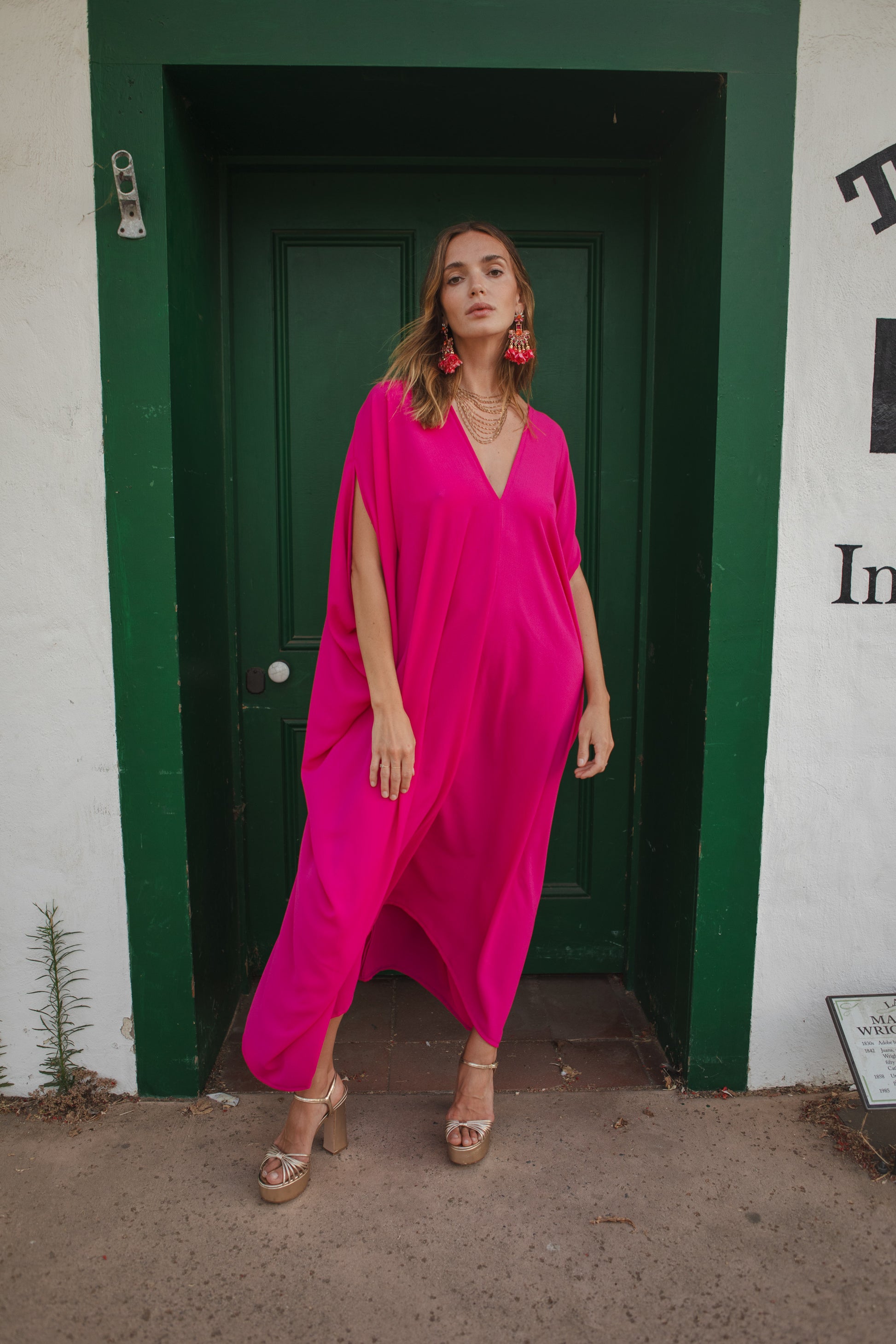 Bright, bold, solid hot pink caftan featuring a deep v-neck and short, batwing sleeves. Funky, vividly saturated, Barbie-inspired bohemian style. 