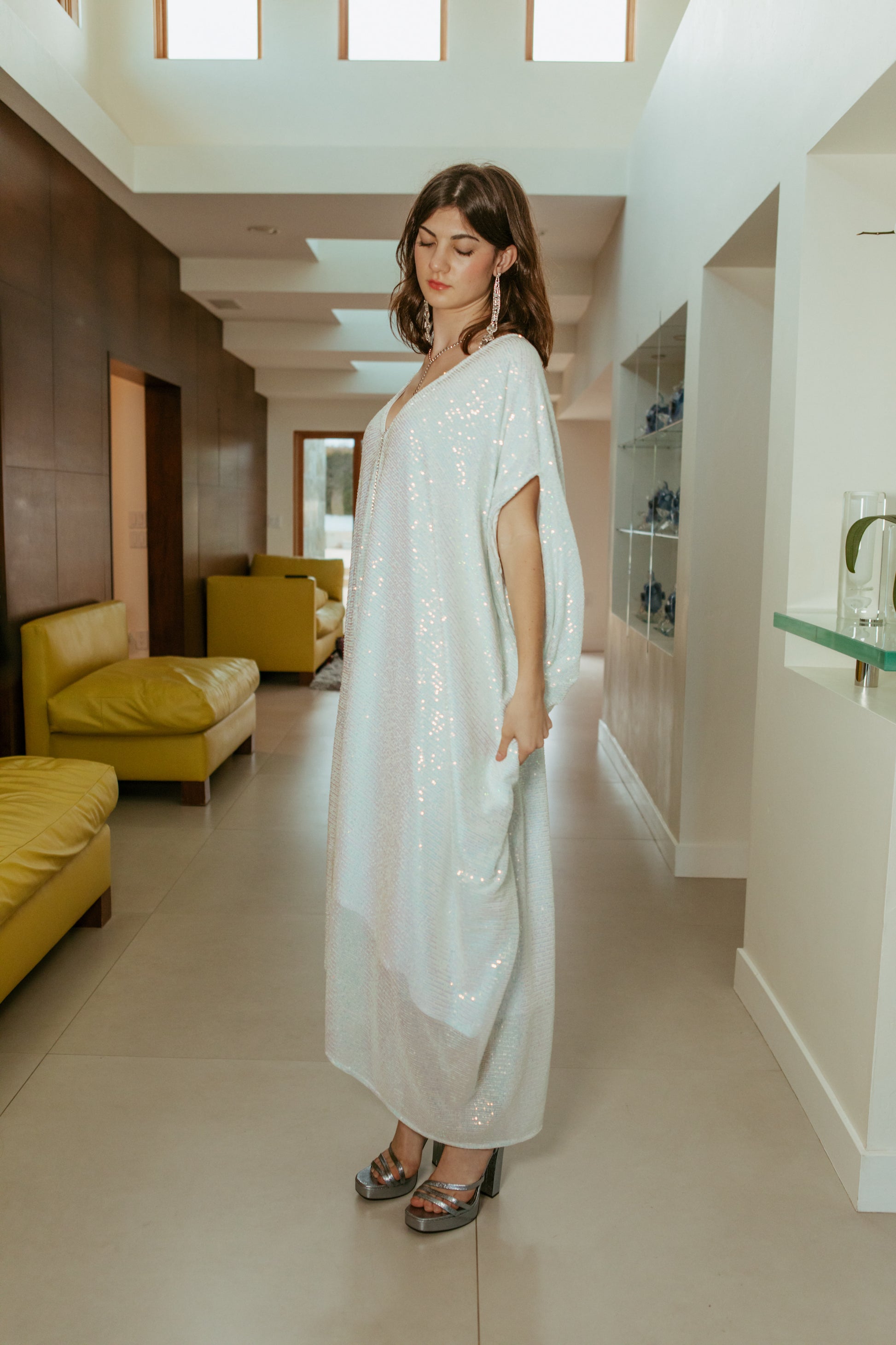 Semi-sheer, lined, shimmering sequin caftan dress in radiant ivory white. Elegant bohemian in style.