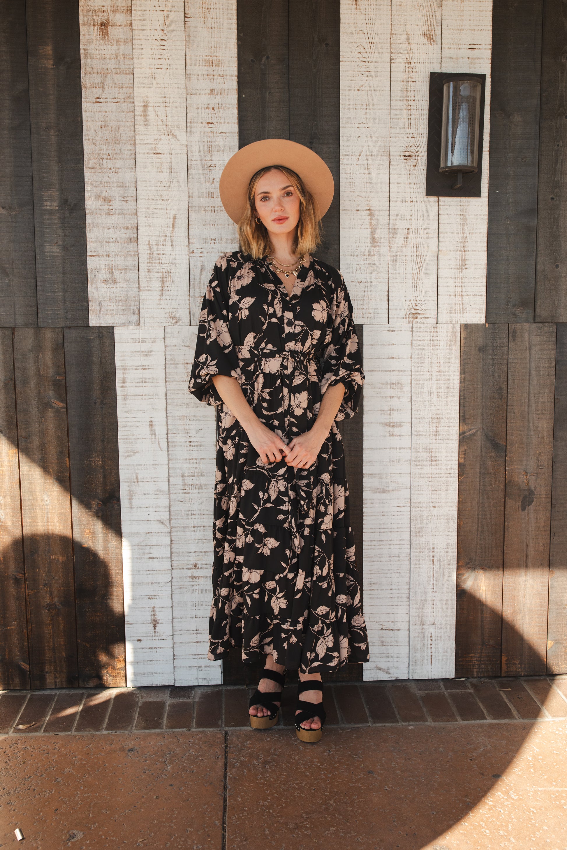 This beautiful maxi dress is made from a feminine floral fabric and comes with an optional sash belt.