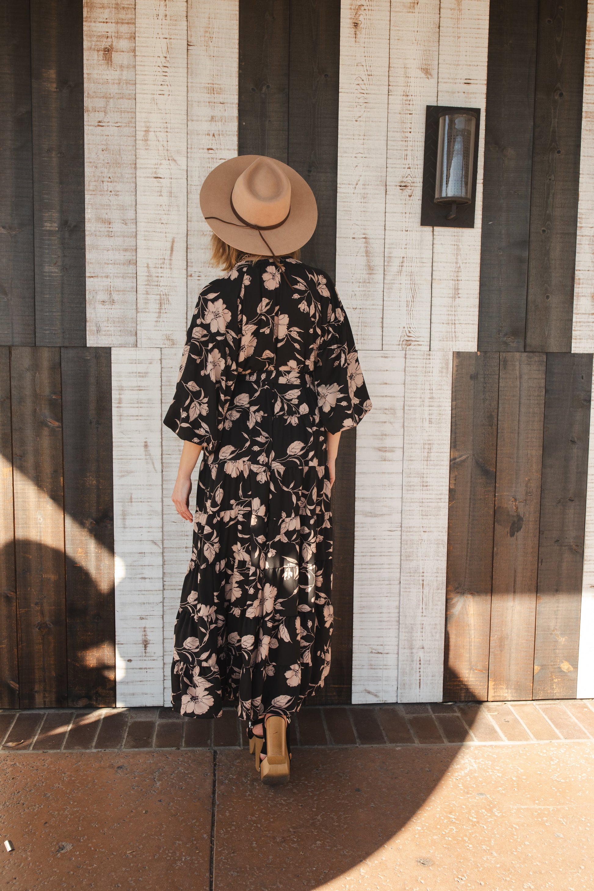 This beautiful maxi dress is made from a feminine floral fabric and comes with an optional sash belt.