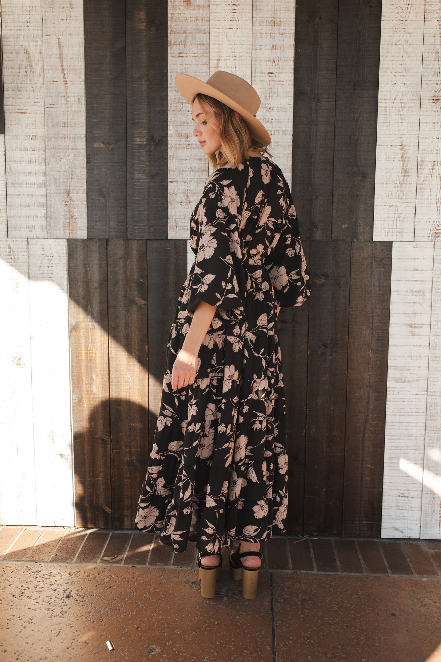 This beautiful maxi dress is made from a feminine floral fabric and comes with an optional sash belt.