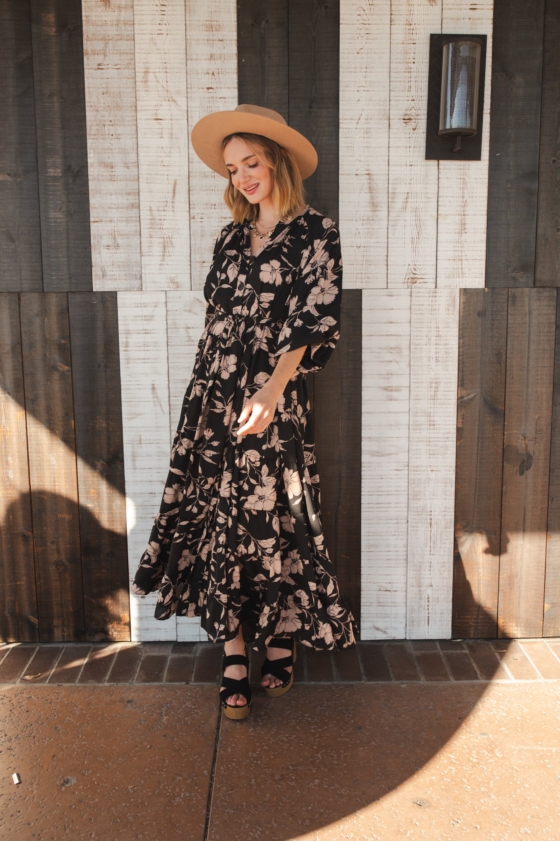 This beautiful maxi dress is made from a feminine floral fabric and comes with an optional sash belt.